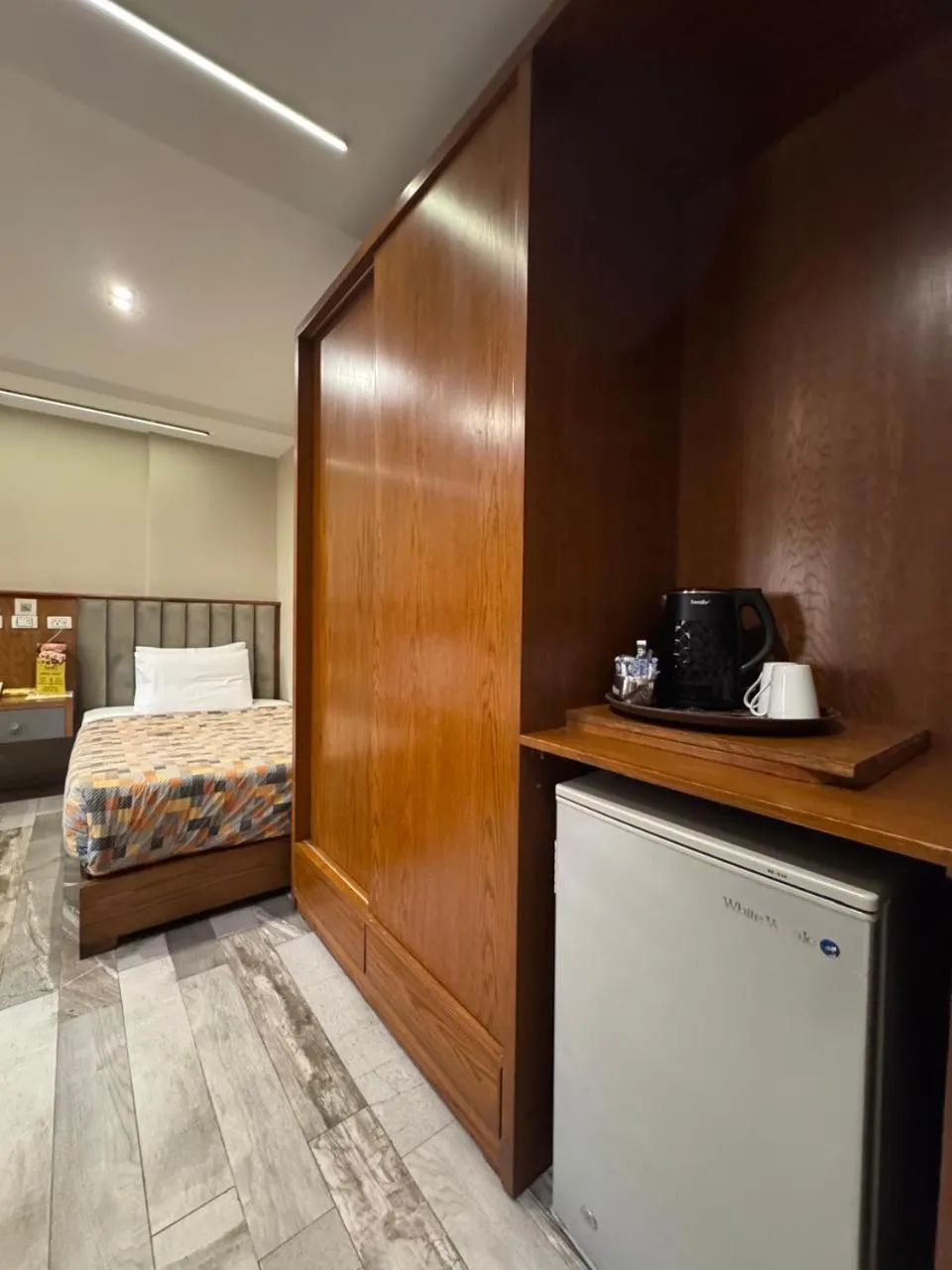 Bed in Garden City Plaza Hotel