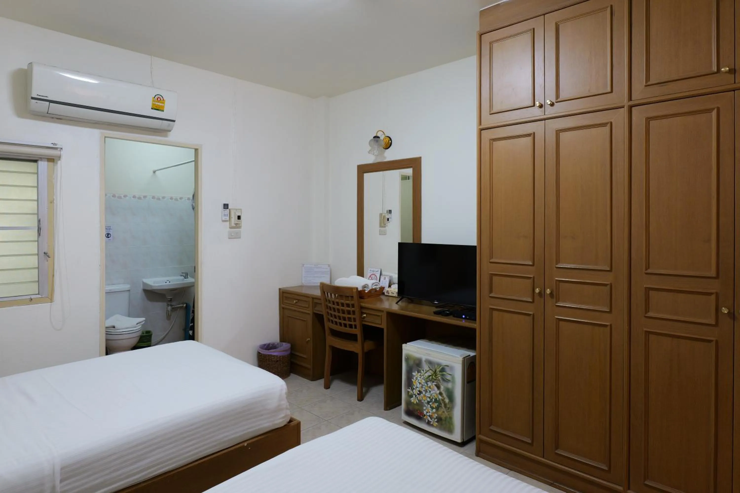 Bed in โรงแรมมูนแอนด์ซัน Moon and Sun Hotel