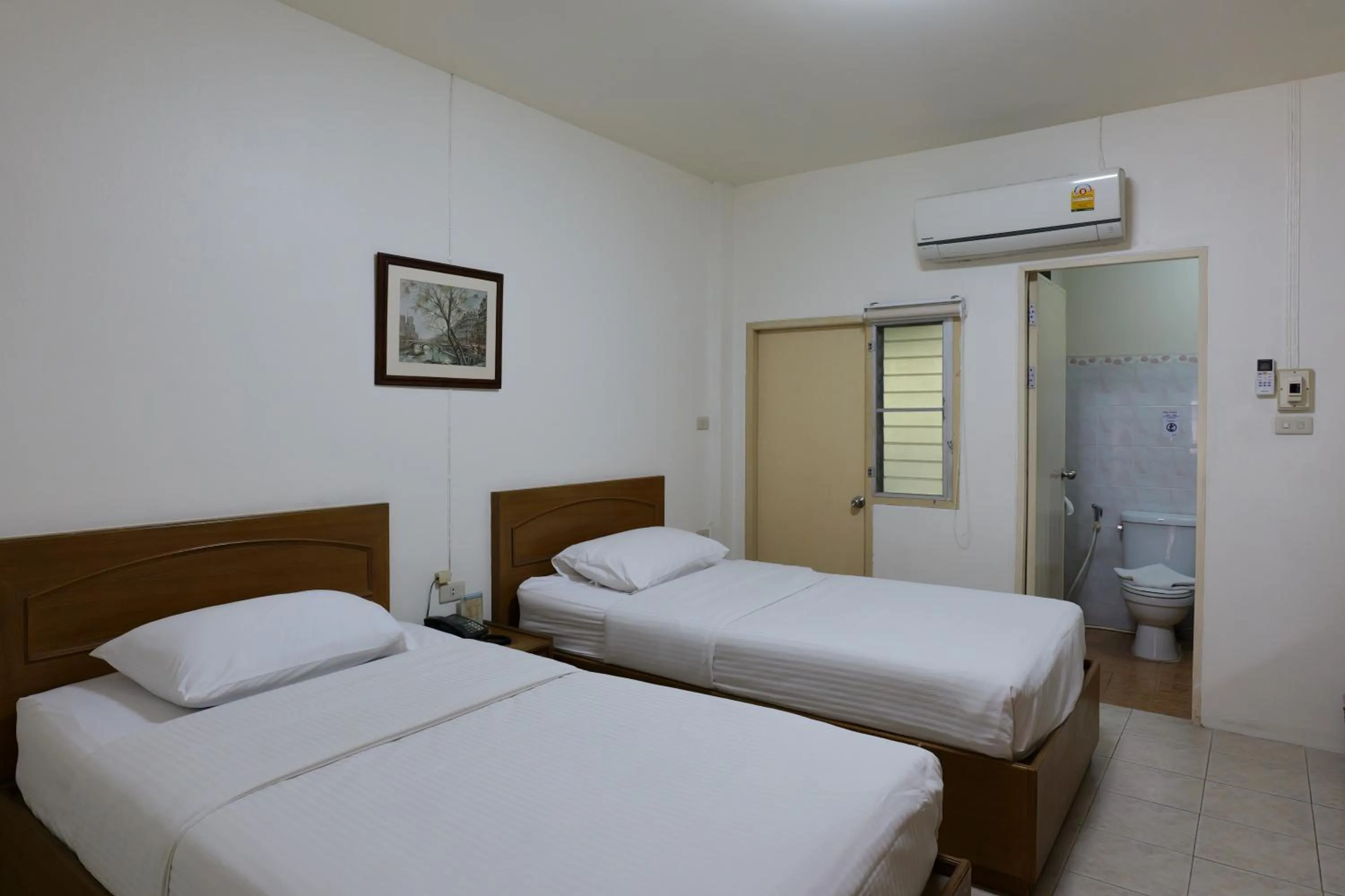 Bed in โรงแรมมูนแอนด์ซัน Moon and Sun Hotel