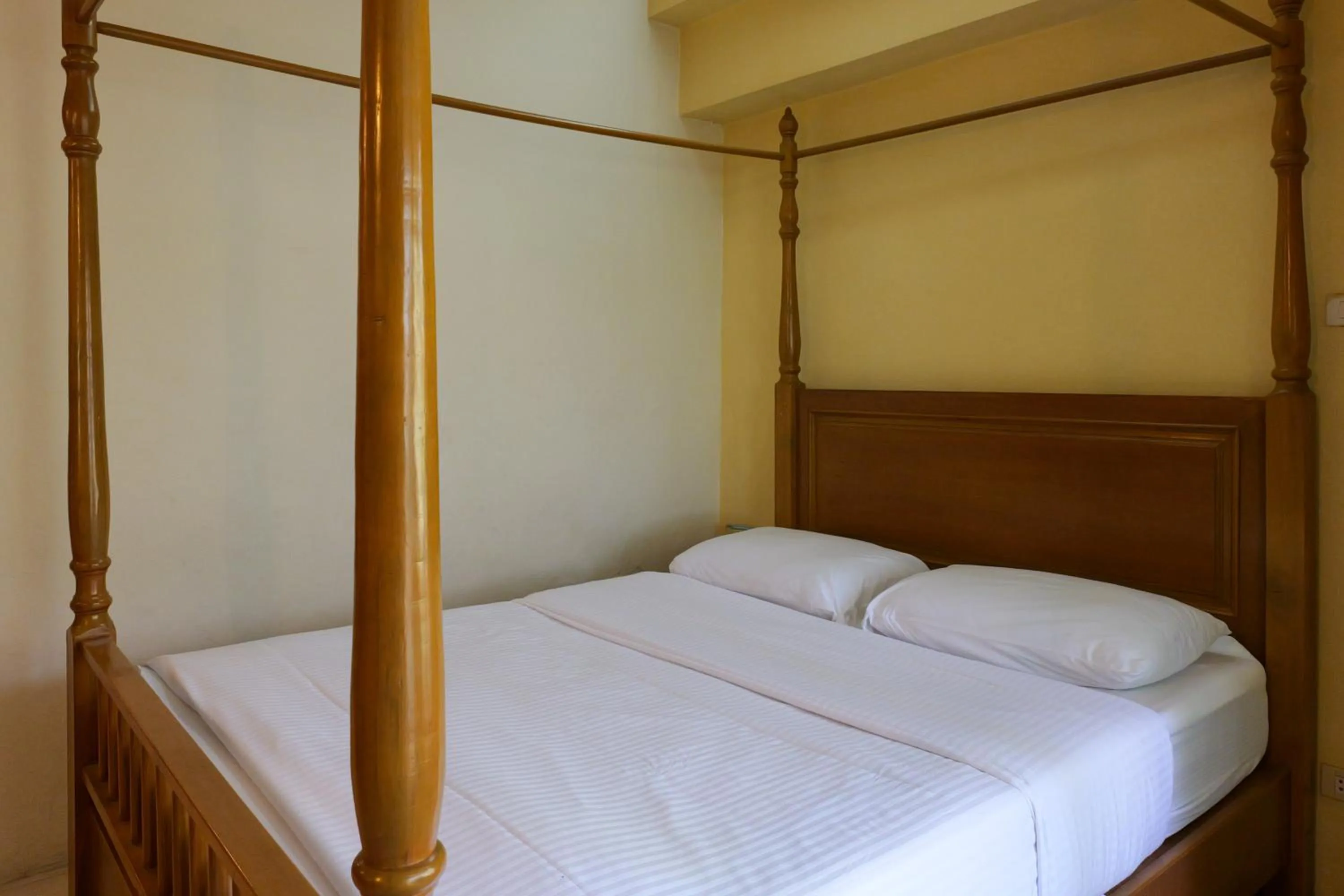 Bed in โรงแรมมูนแอนด์ซัน Moon and Sun Hotel
