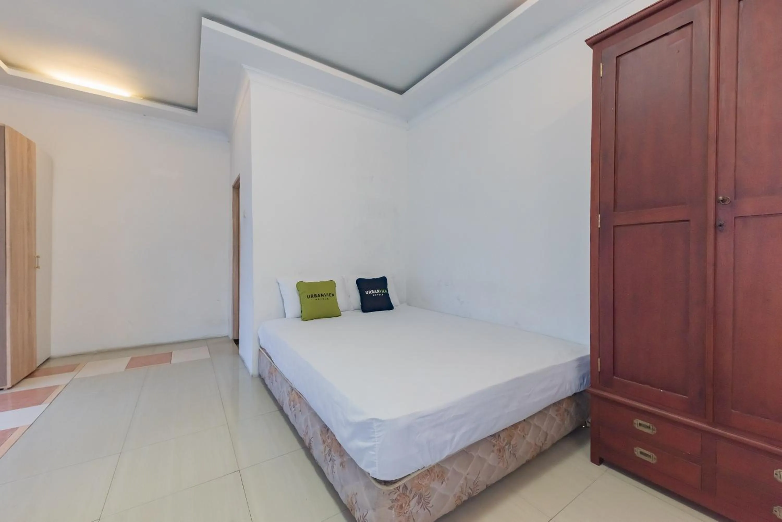 Bed in Urbanview Hotel Anggrek Puncak by RedDoorz