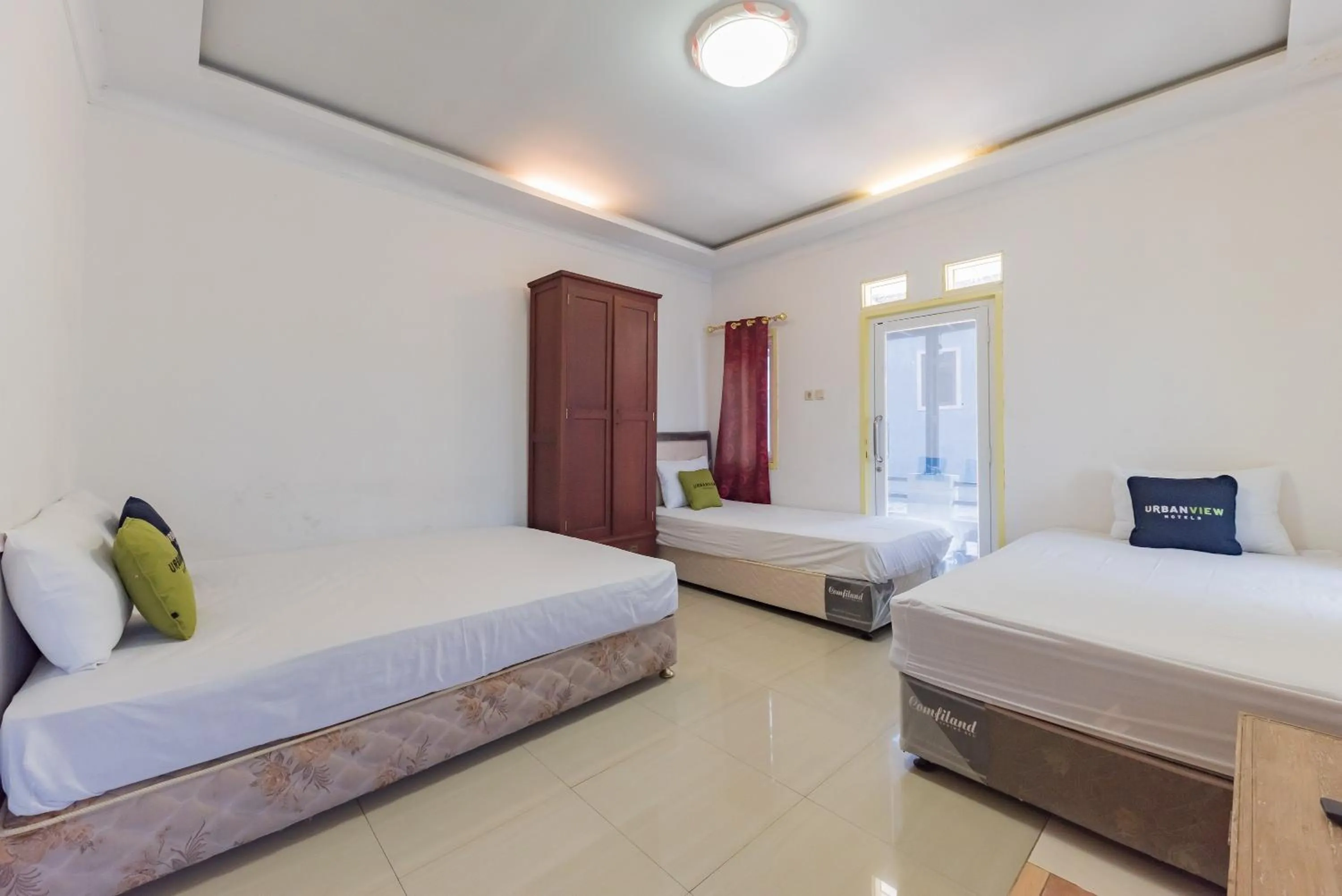 Bed in Urbanview Hotel Anggrek Puncak by RedDoorz