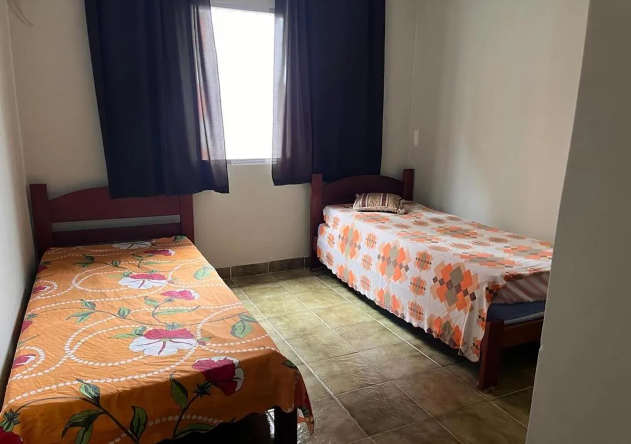 Bedroom, Bed in Apartamento Vila Tupi Praia Grande