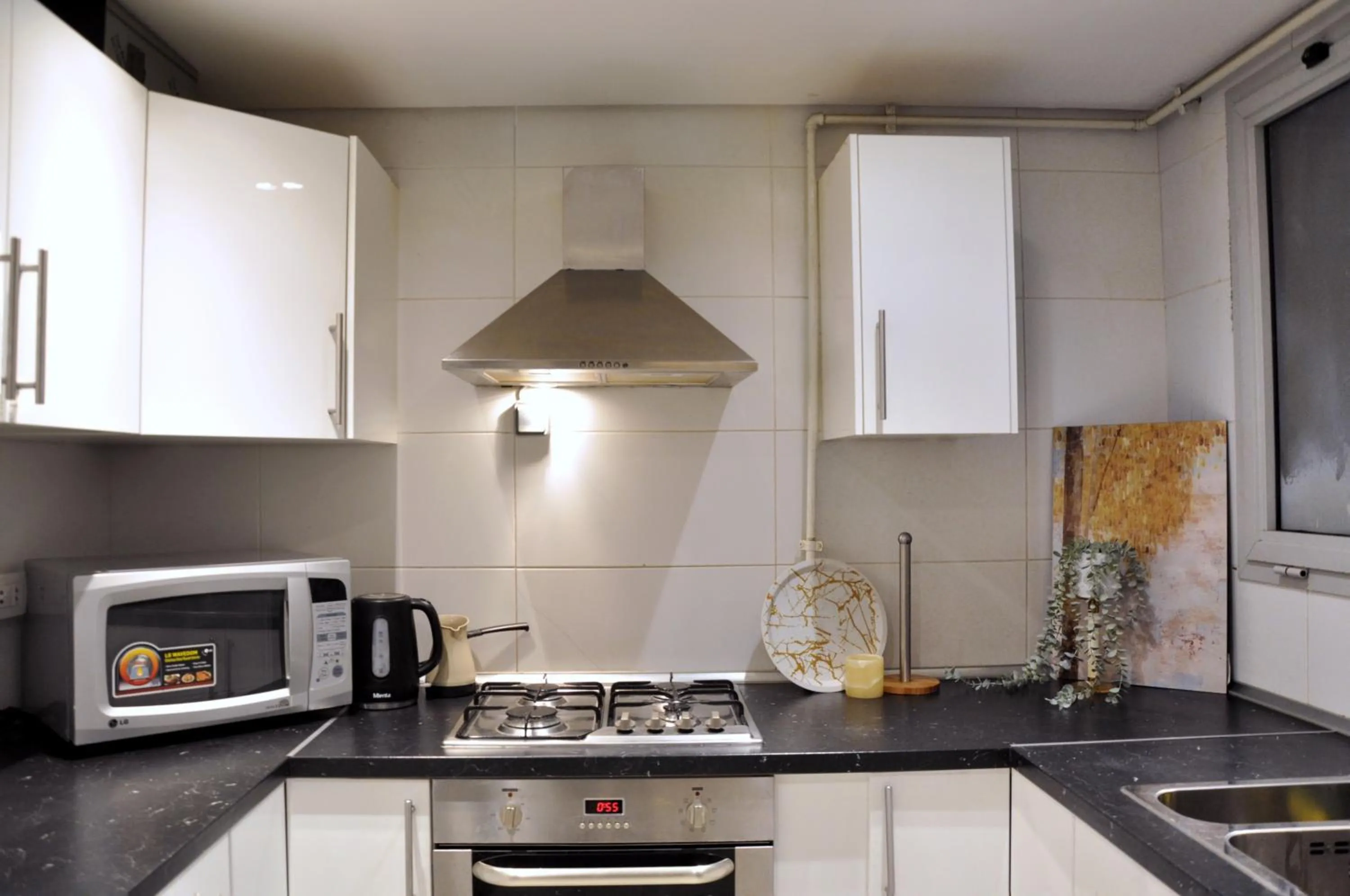 Kitchen or kitchenette in Axxodia- Apartments In Cairo Festival City
