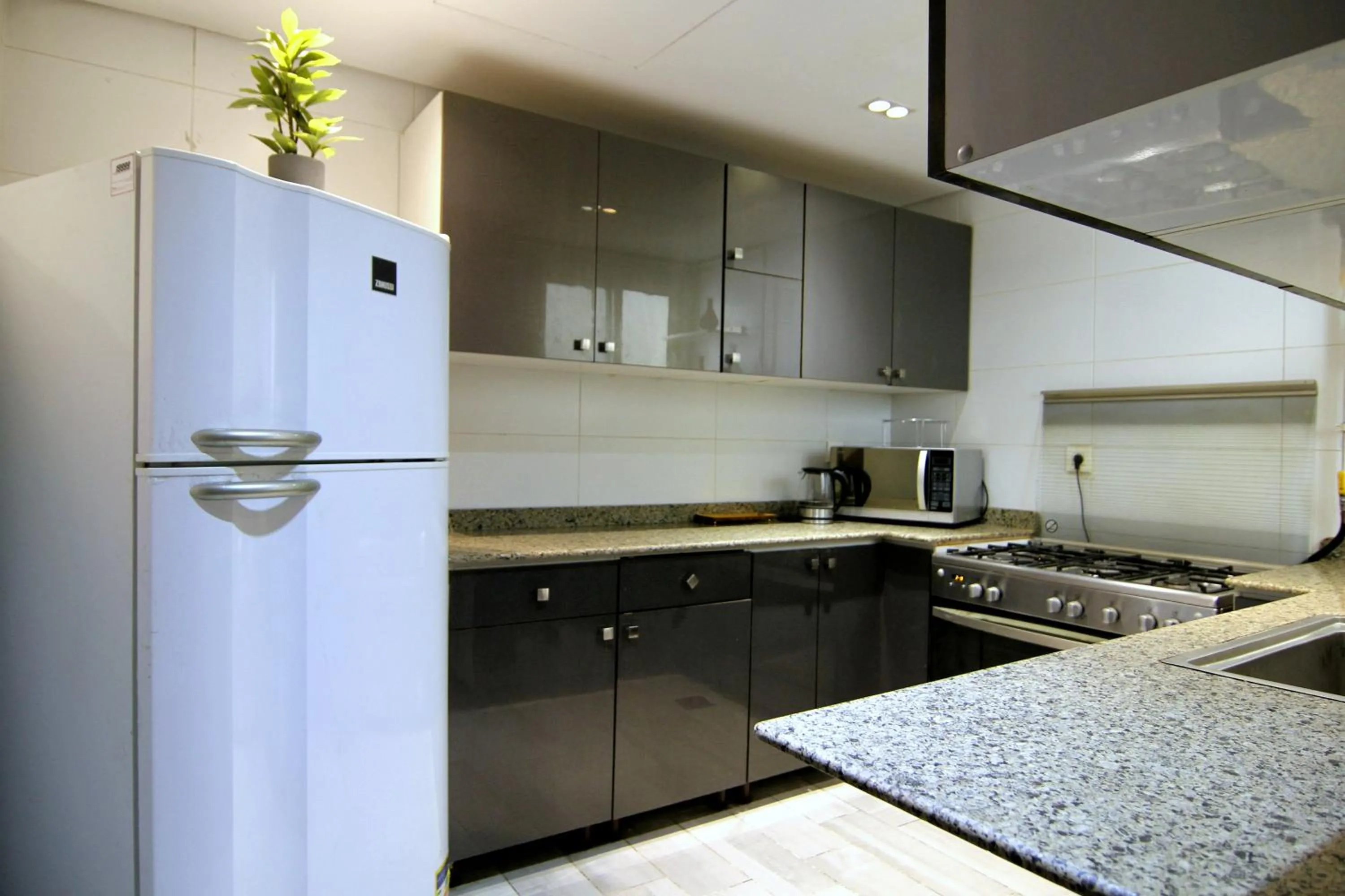 kitchen in Axxodia- Apartments In Cairo Festival City
