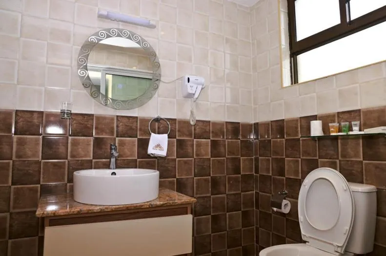 Toilet in Hylise Hotel