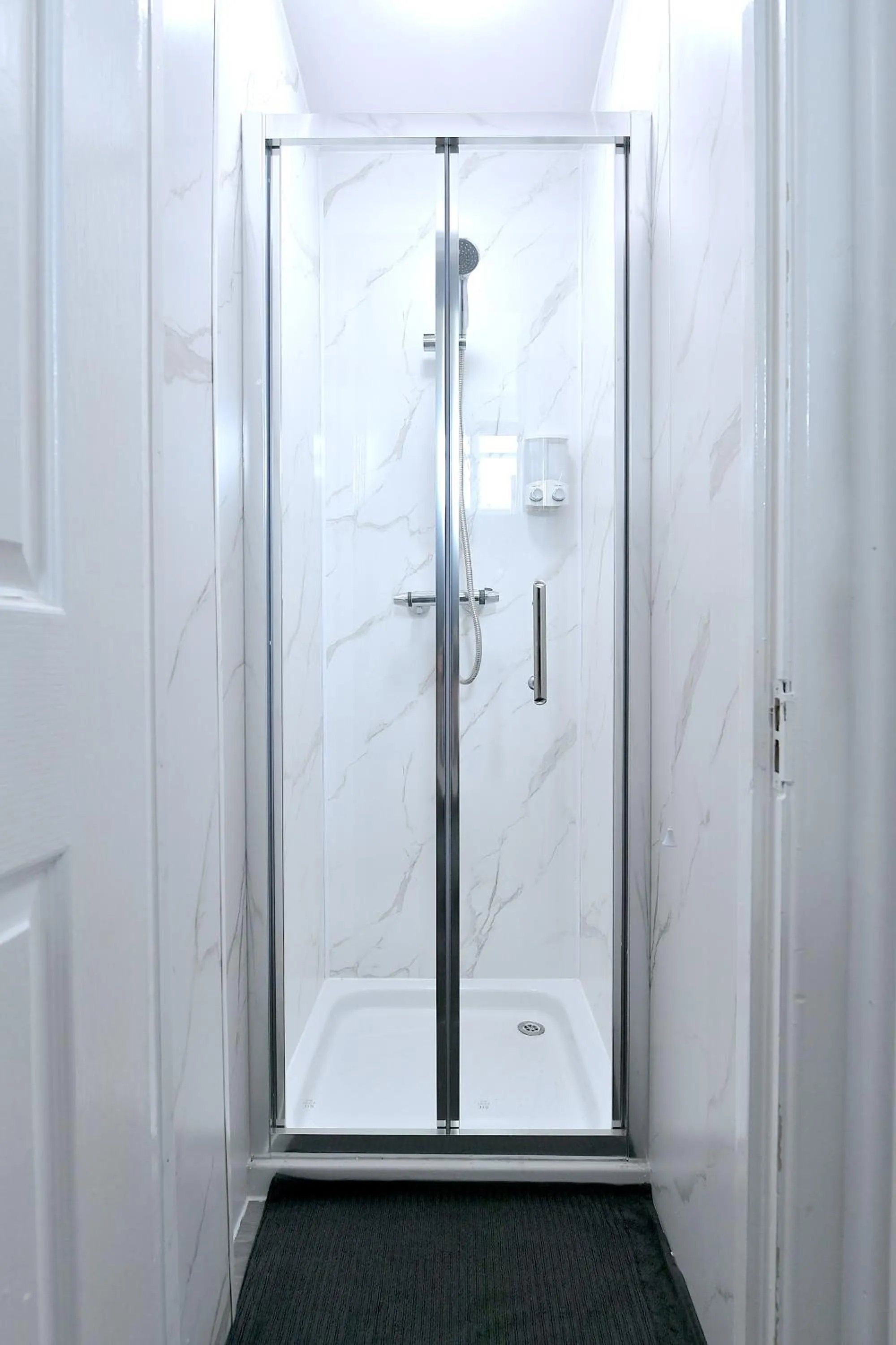 Shower in Stylish Studios by Luxestays Fulham
