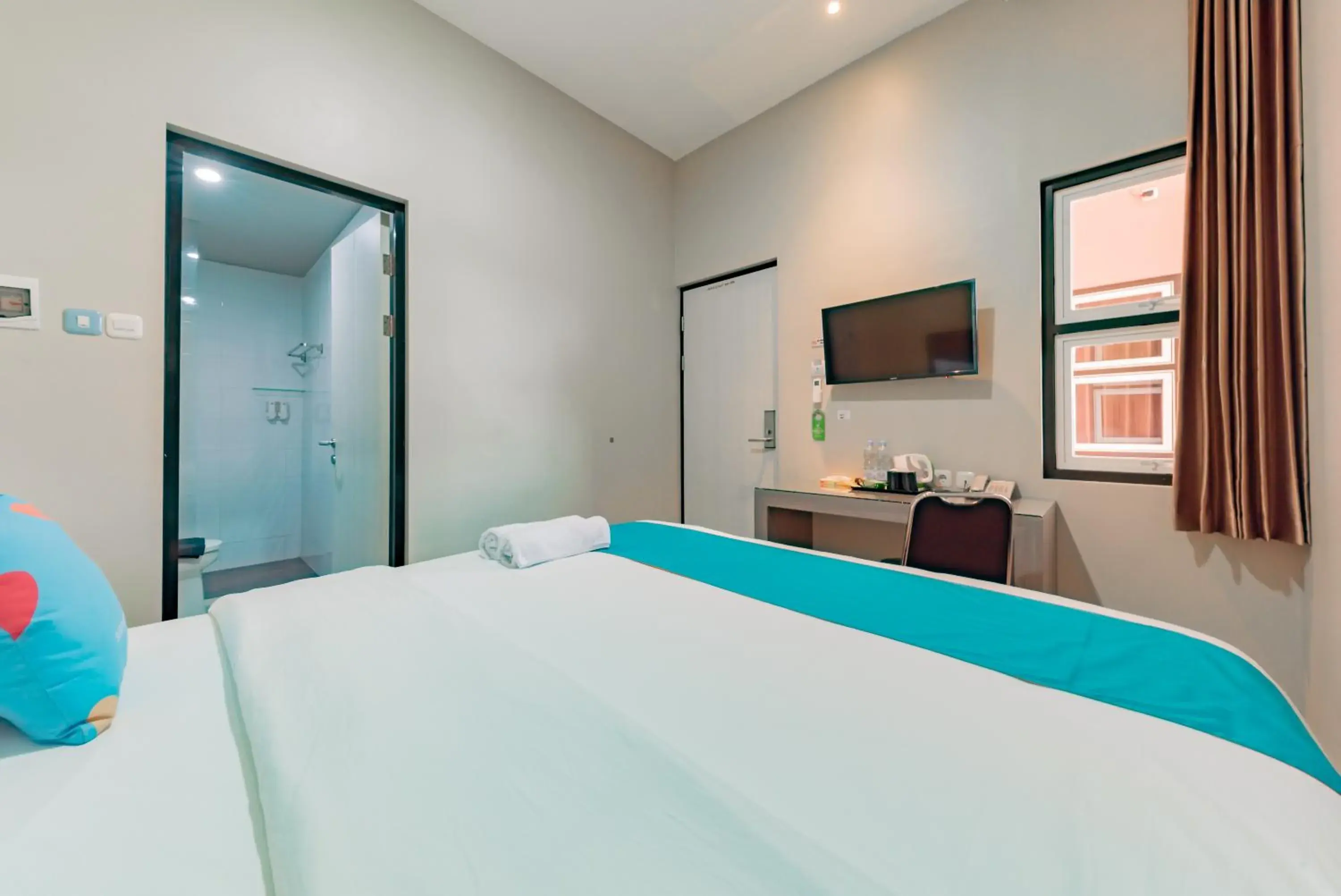 Bedroom, Bed in Sans Hotel Berau Square Bedroom, Bed in Sans Hotel Berau Square