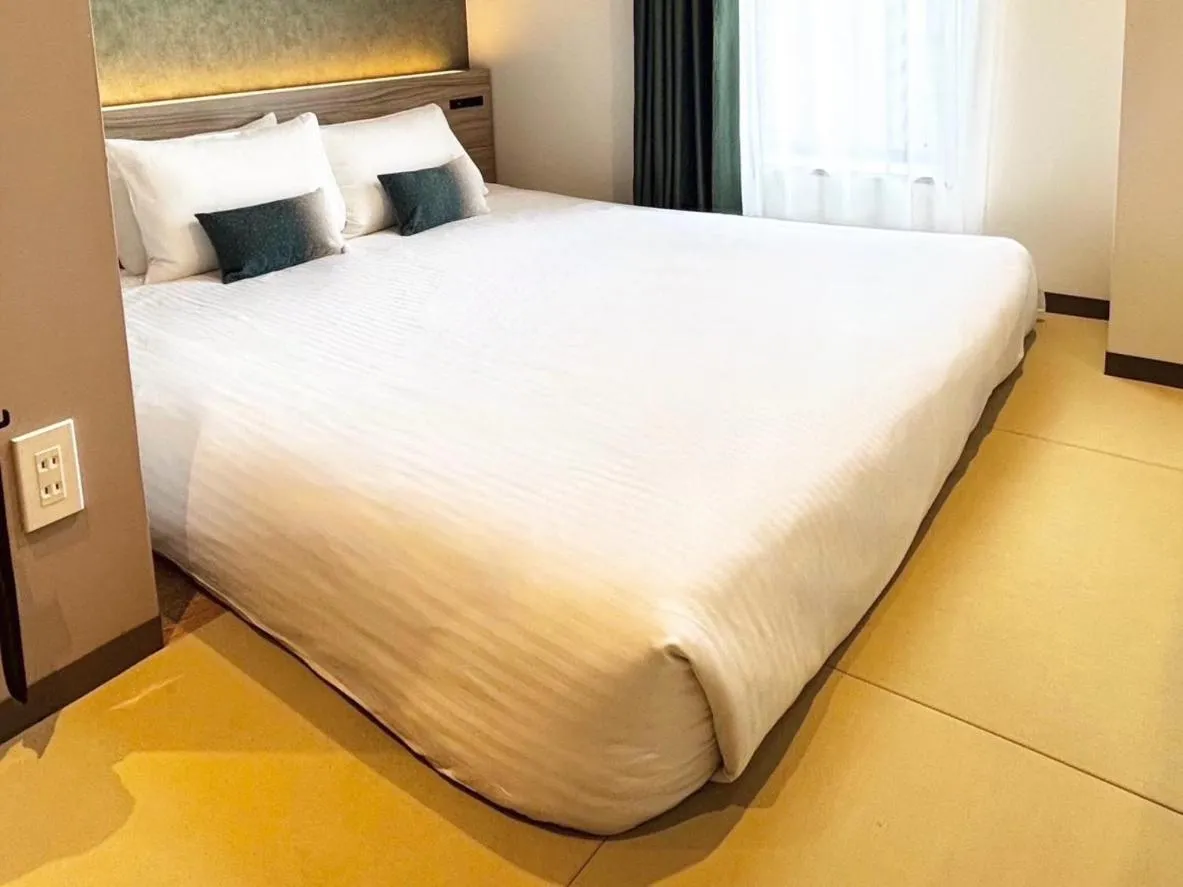 Photo of the whole room, Bed in HOTEL AMANEK Shinjuku Kabukicho