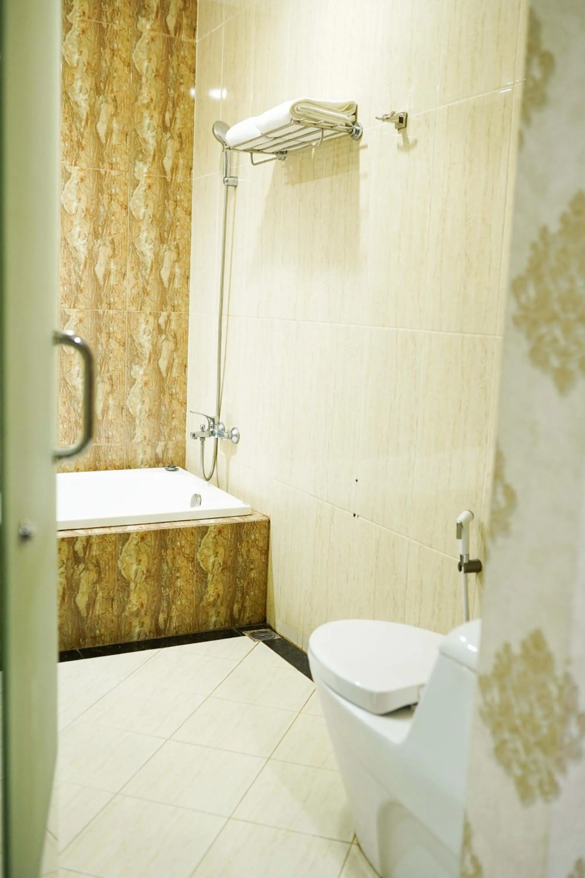 Bed in Grand Buana Lestari Hotel