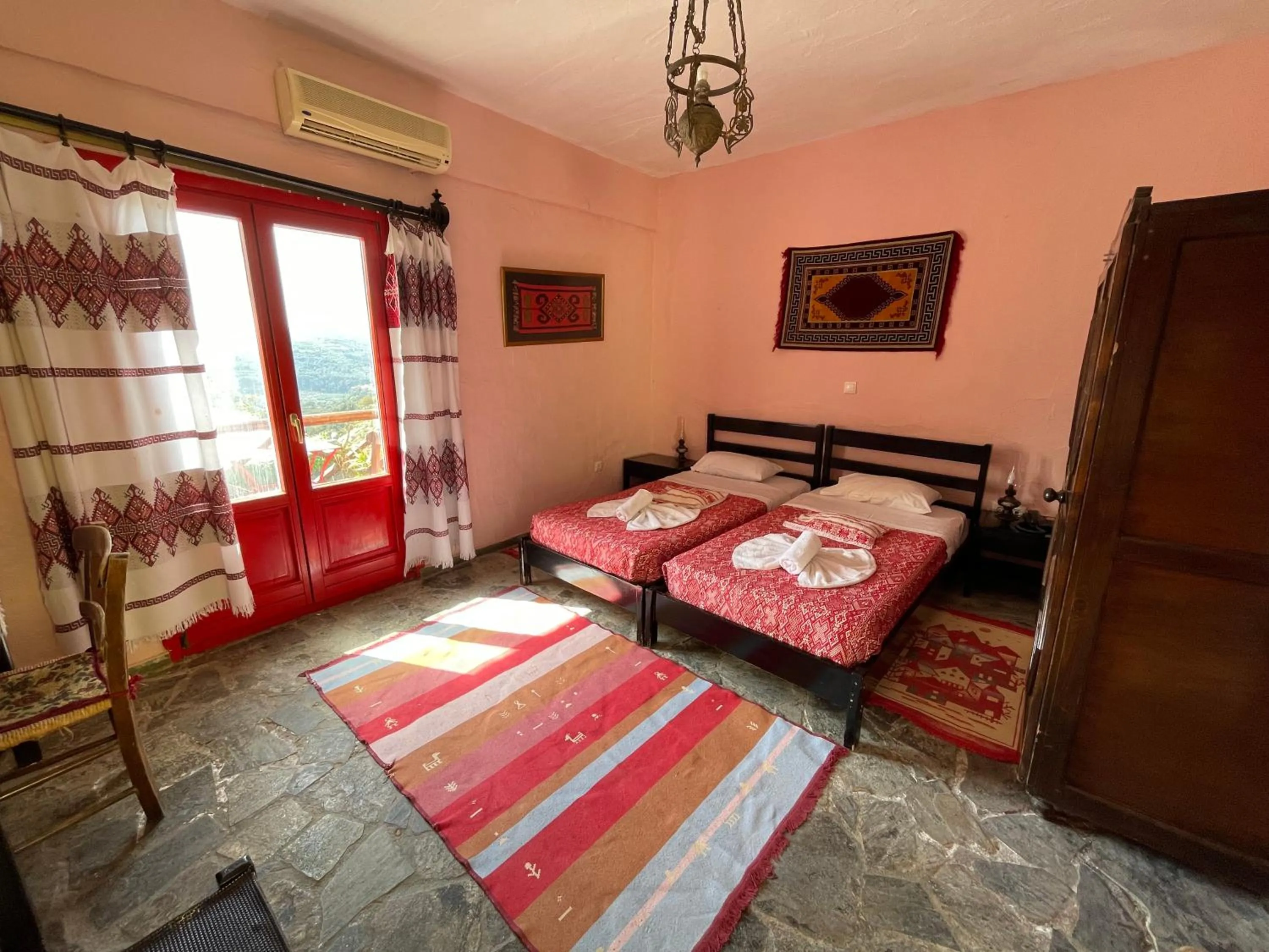 Bed in Arolithos Traditional Village Hotel