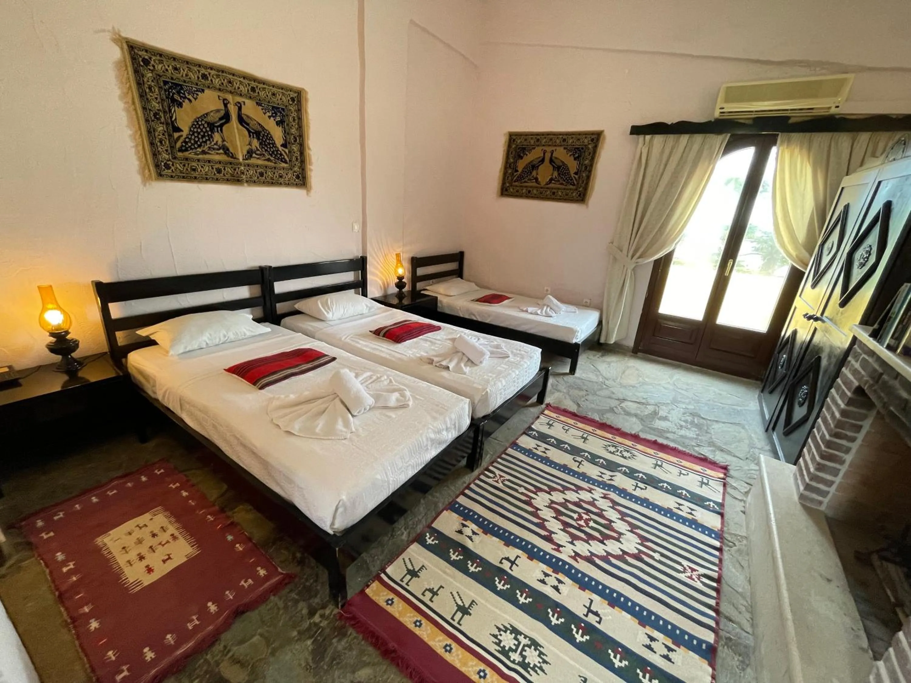 Bed in Arolithos Traditional Village Hotel