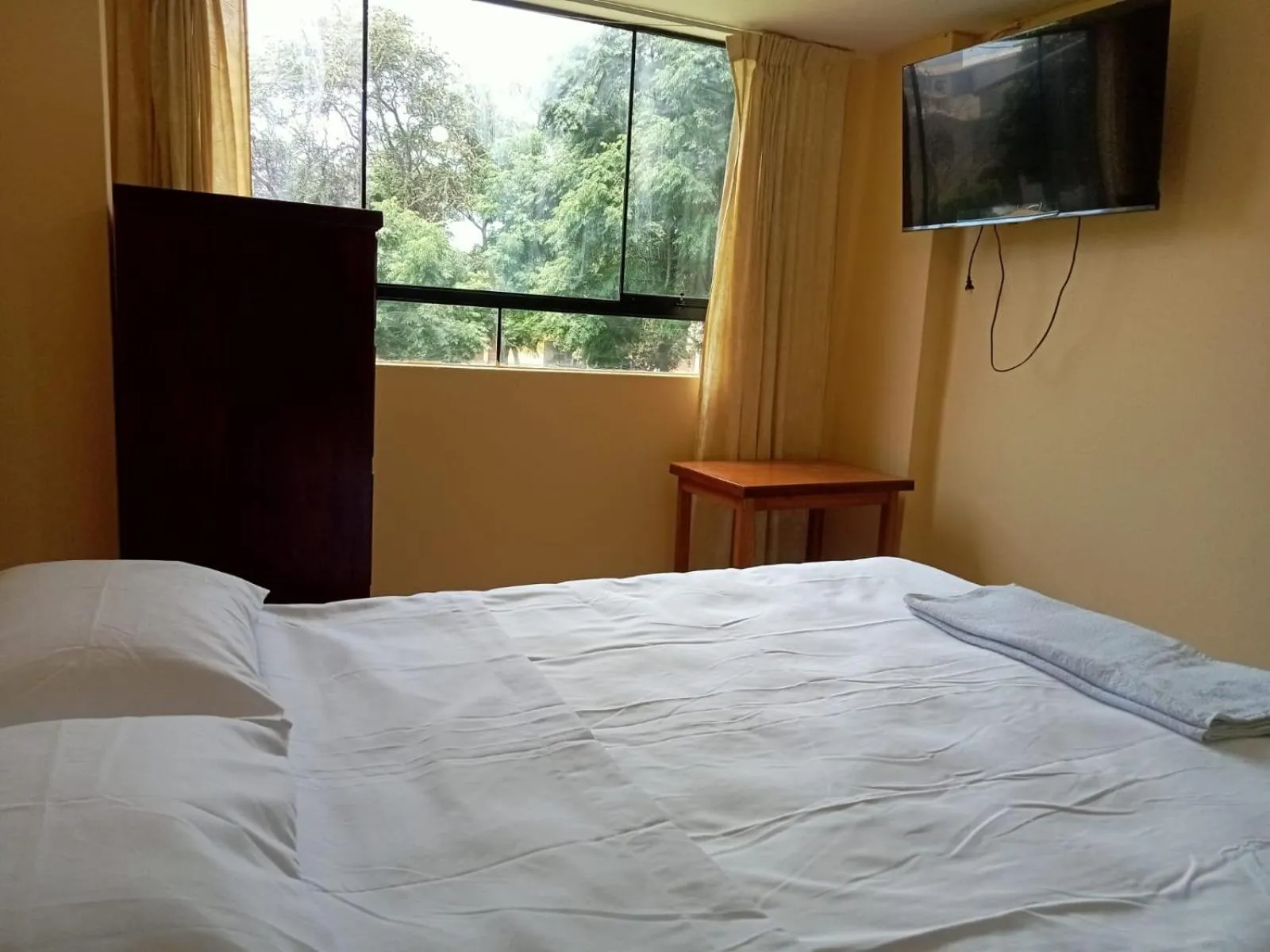 Bed in ROARI HOTEL