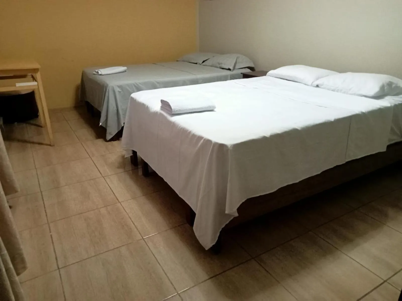 Bed in ROARI HOTEL