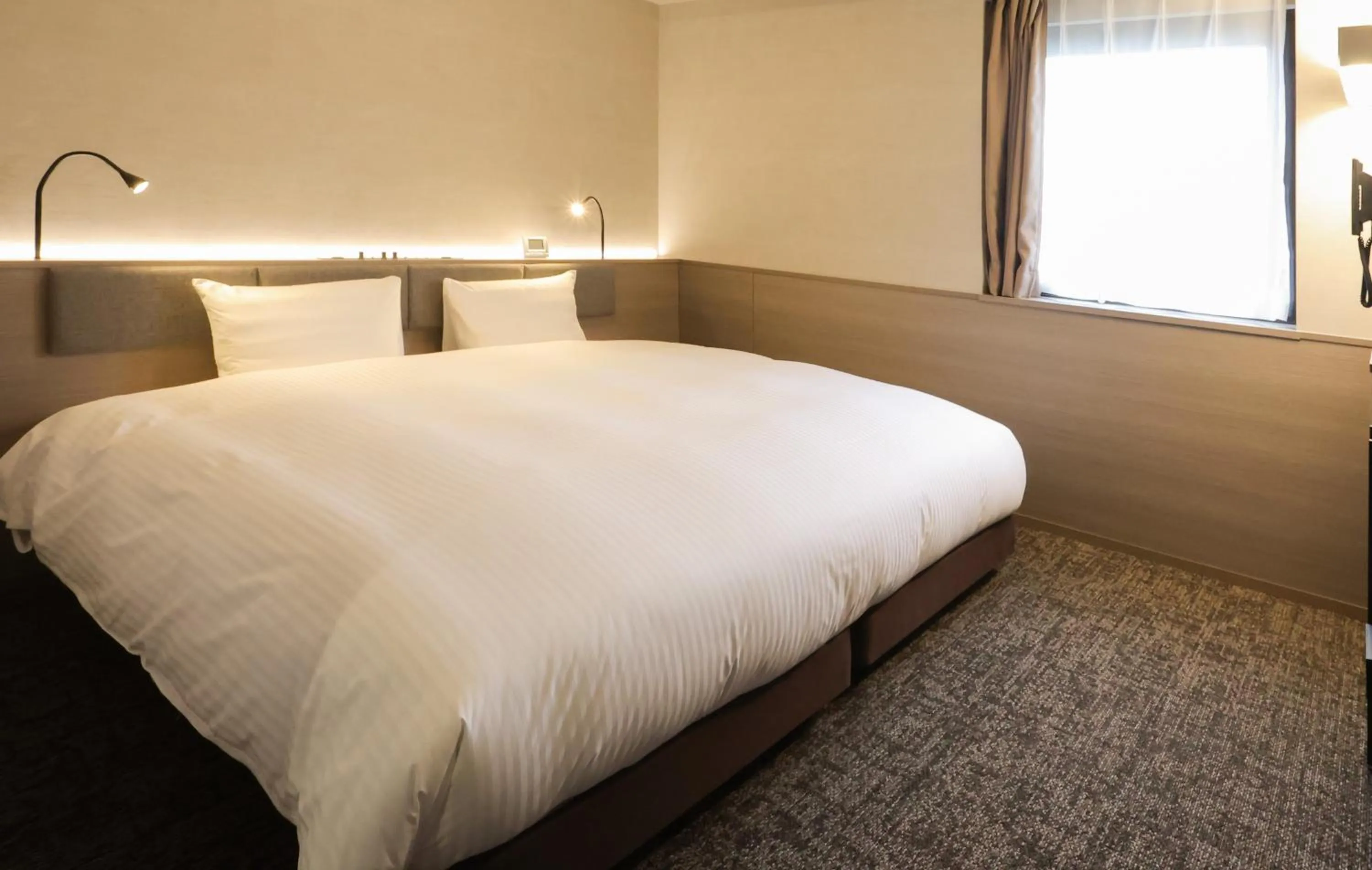 Bed in SK HOTEL Kobe Ekimae