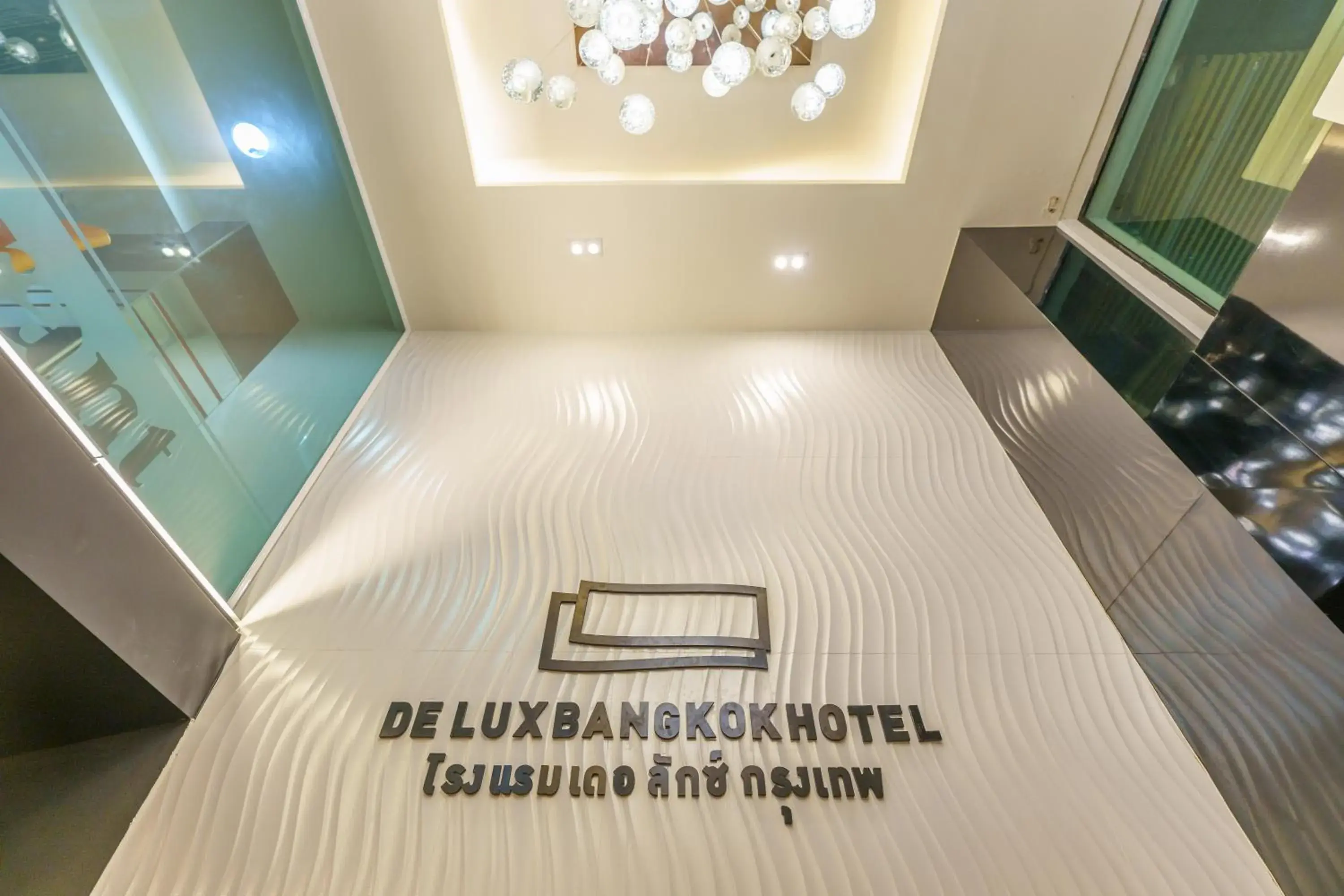 Property logo or sign, Bed in De Lux Bangkok Hotel Property logo or sign, Bed in De Lux Bangkok Hotel