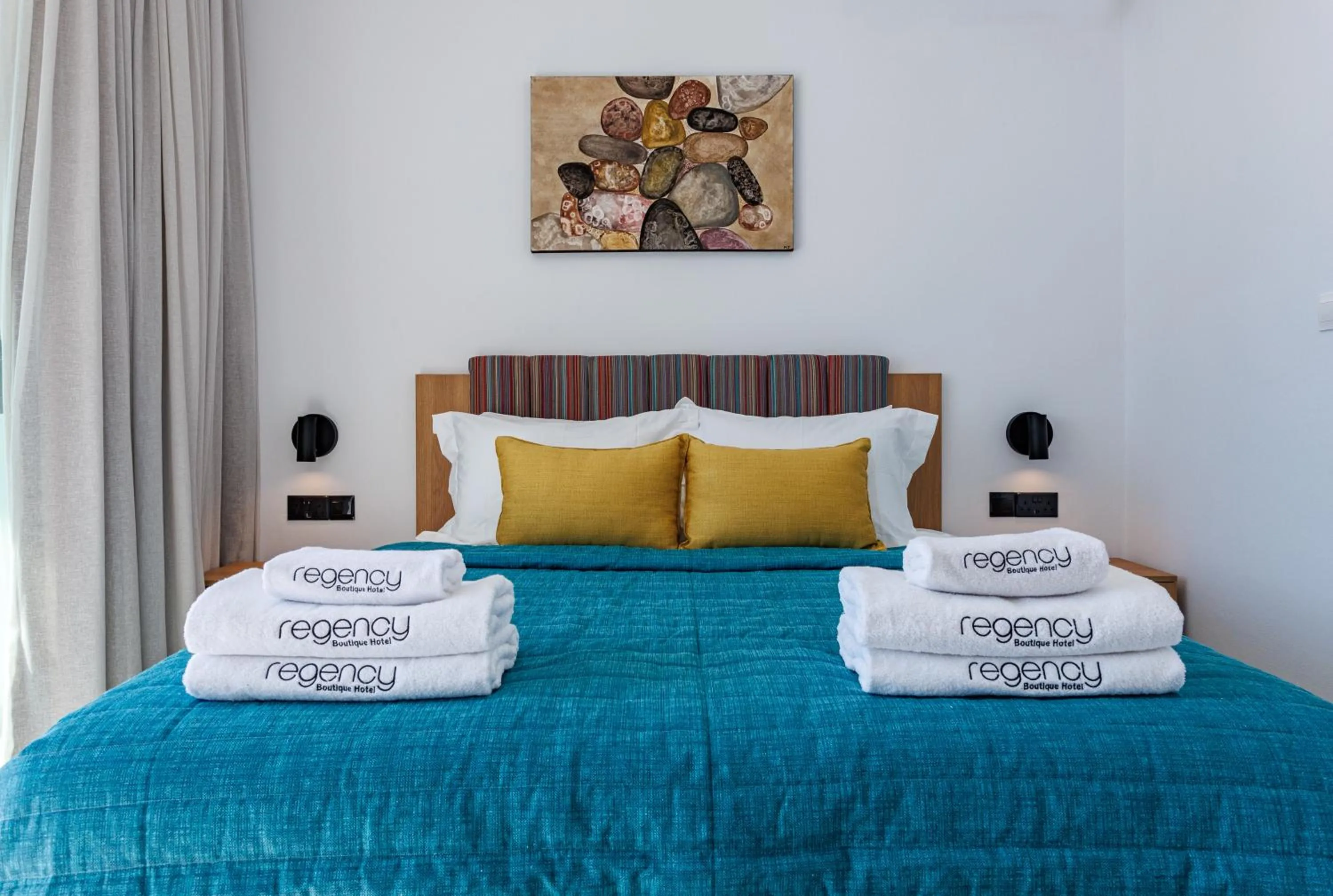 Bed in Regency Boutique Hotel Holiday Suites