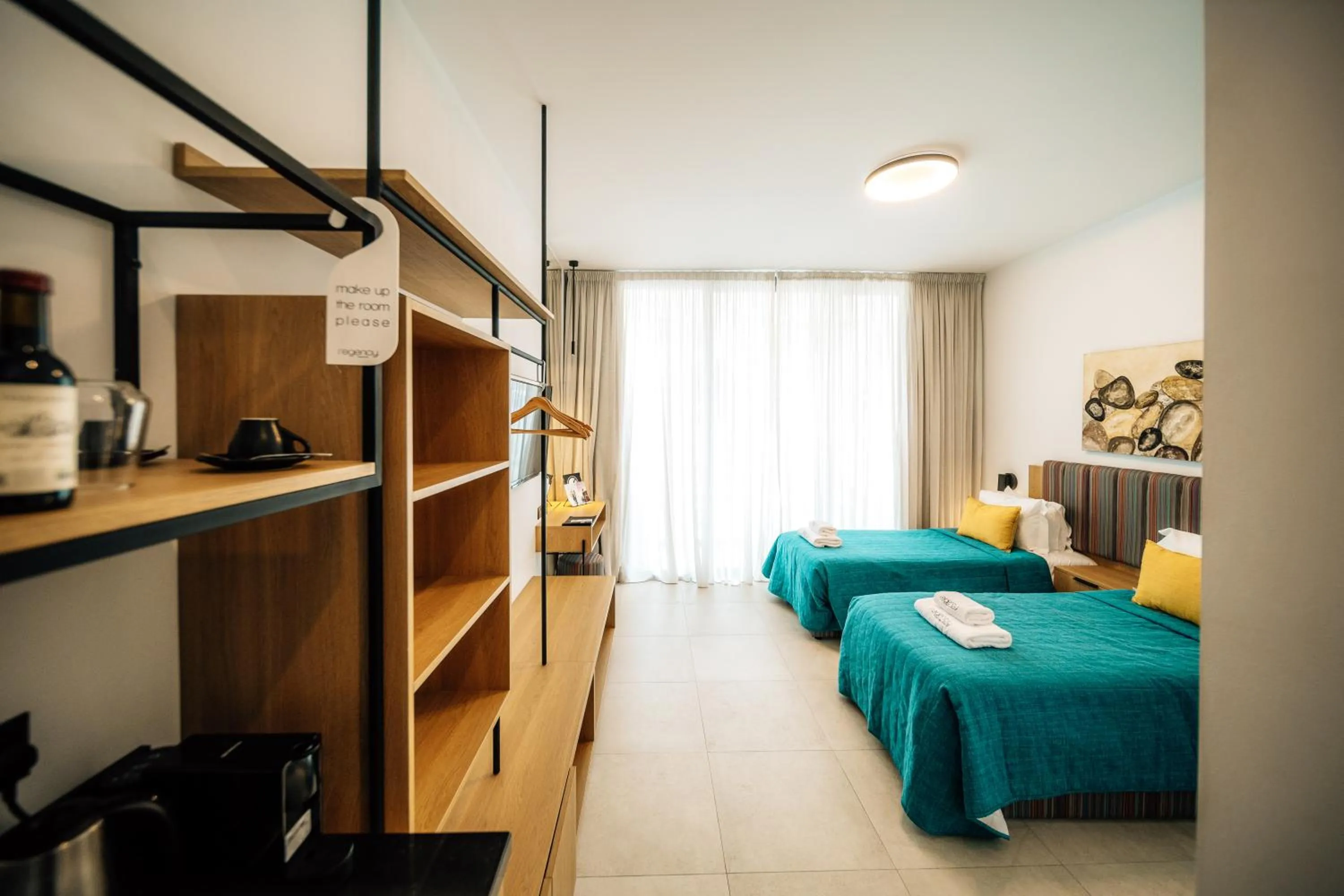 Bed in Regency Boutique Hotel Holiday Suites