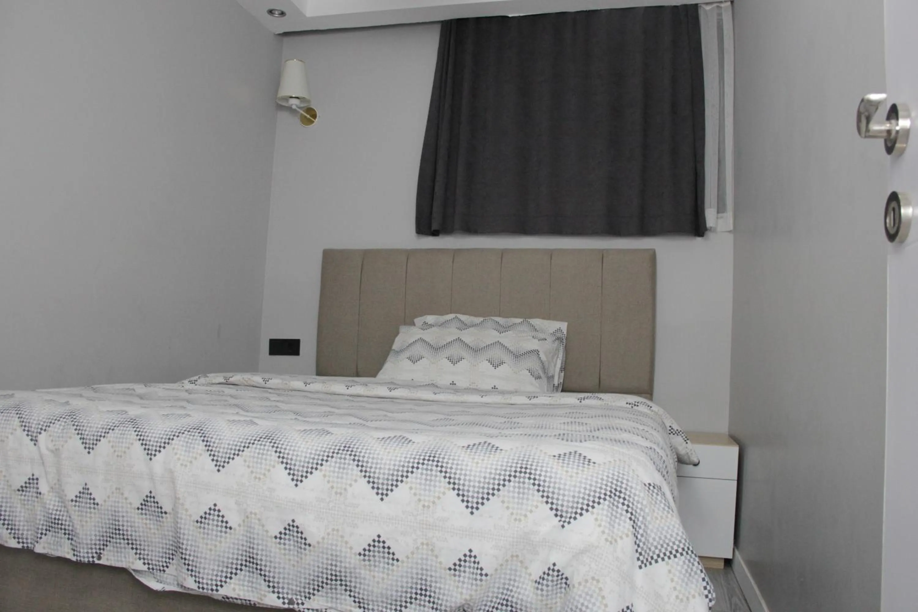Bed in Solo Suites Hotel