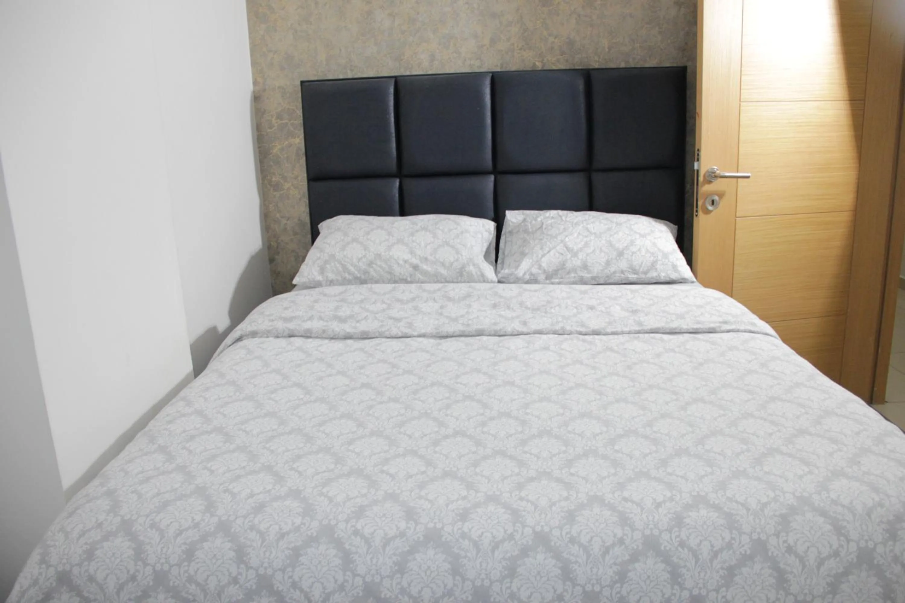 Bed in Solo Suites Hotel