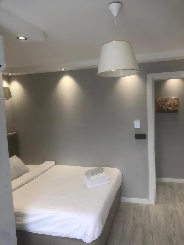 Bed in Solo Suites Hotel