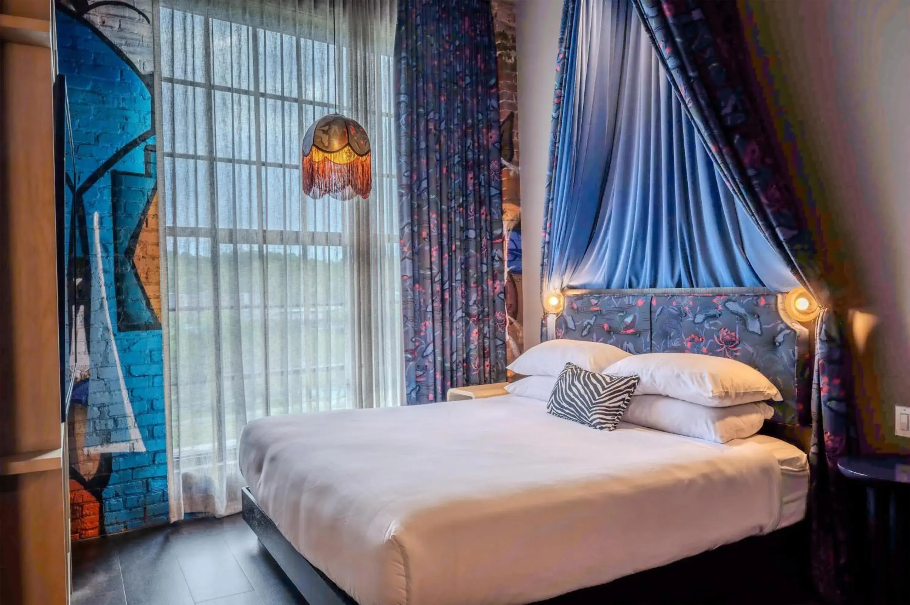 Bed in The Radical Asheville, Tapestry Collection by Hilton Bed in The Radical Asheville, Tapestry Collection by Hilton