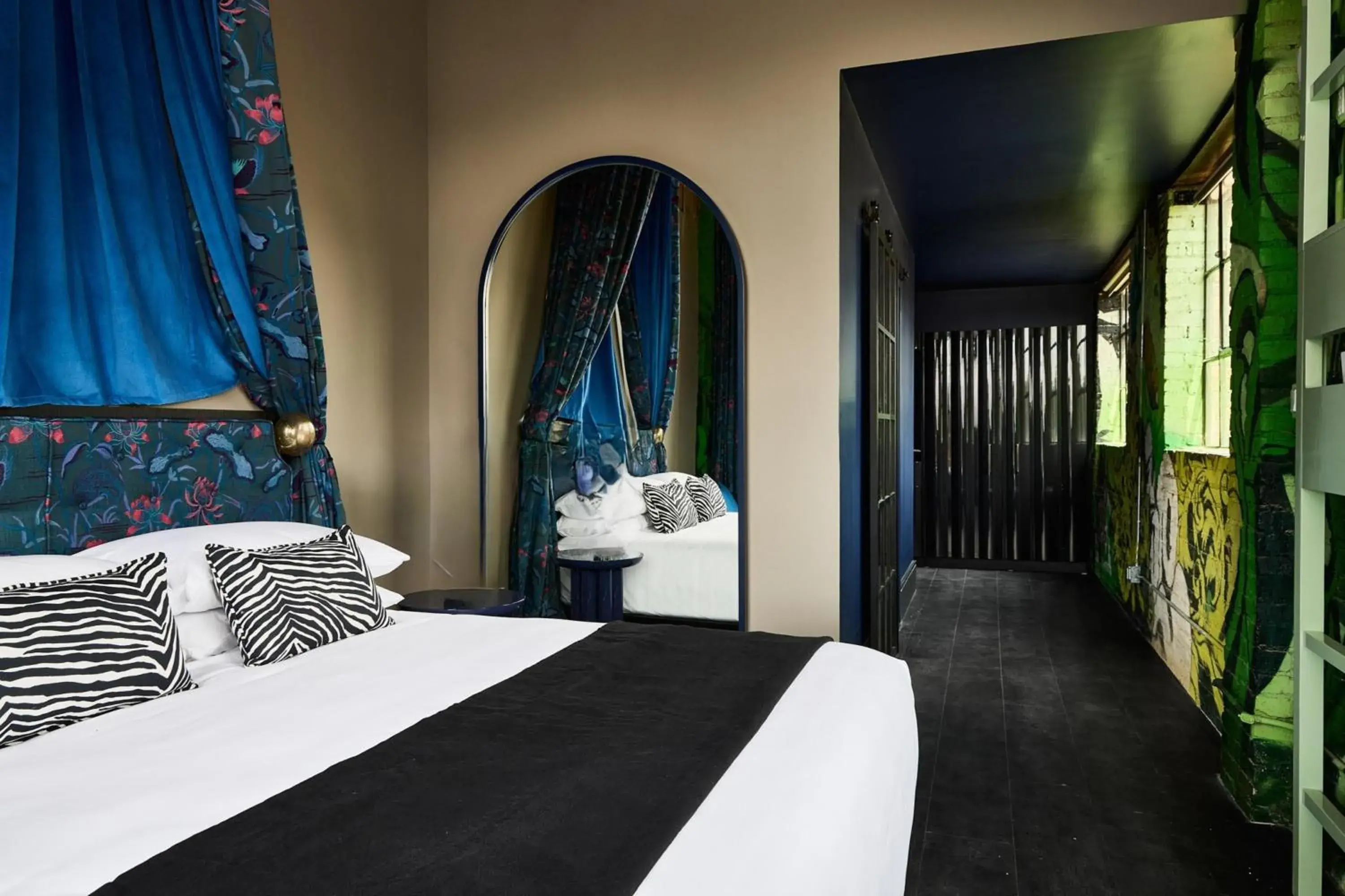 Bed in The Radical Asheville, Tapestry Collection by Hilton Bed in The Radical Asheville, Tapestry Collection by Hilton