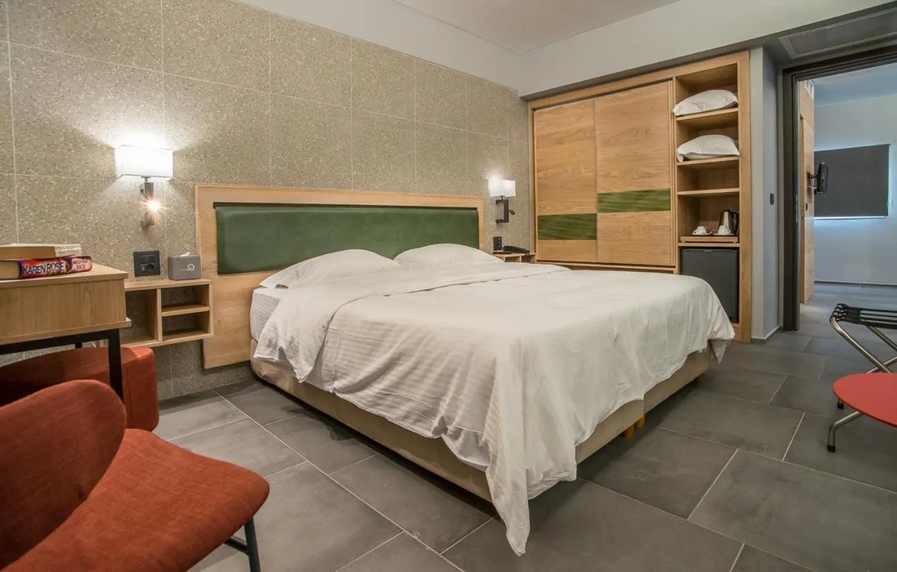 Bed in Palmyra Beach Hotel