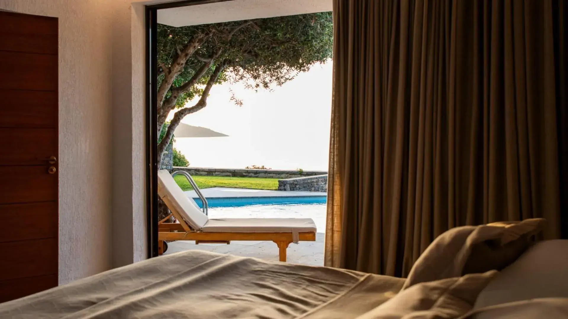 Bedroom, Bed in Elounda Mare Relais & Châteaux Hotel Bedroom, Bed in Elounda Mare Relais & Châteaux Hotel