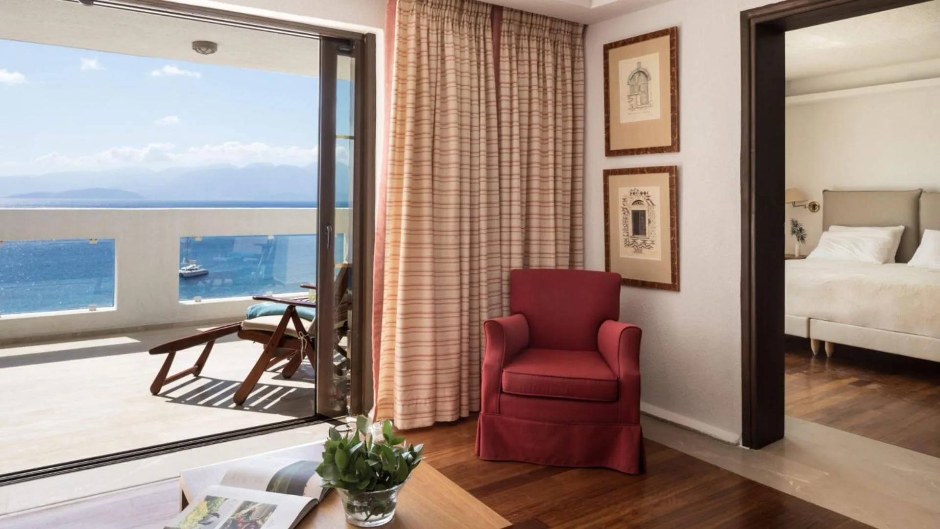 Living room, Bed in Elounda Mare Relais & Châteaux Hotel