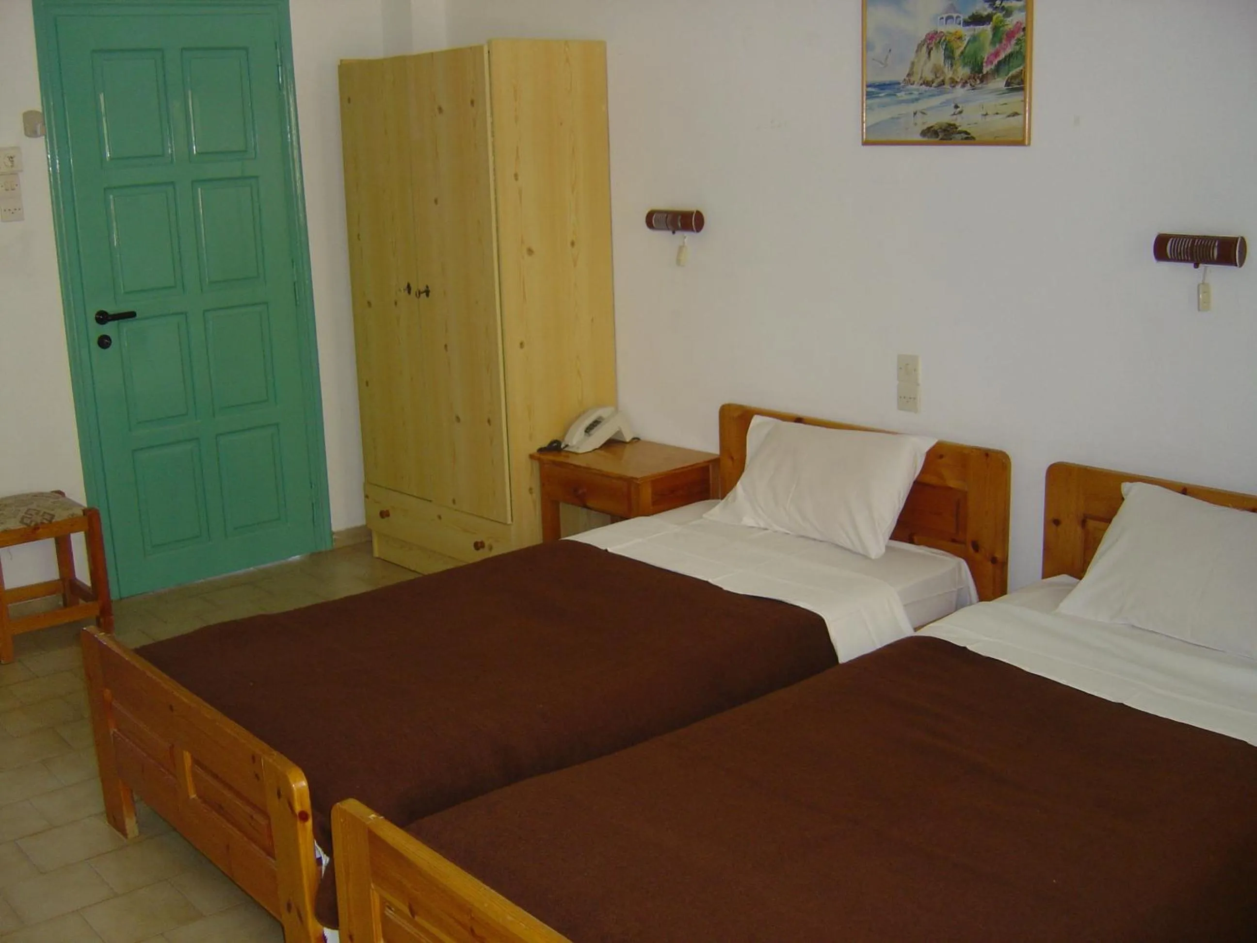 Bed in Dimitris Villa Hotel