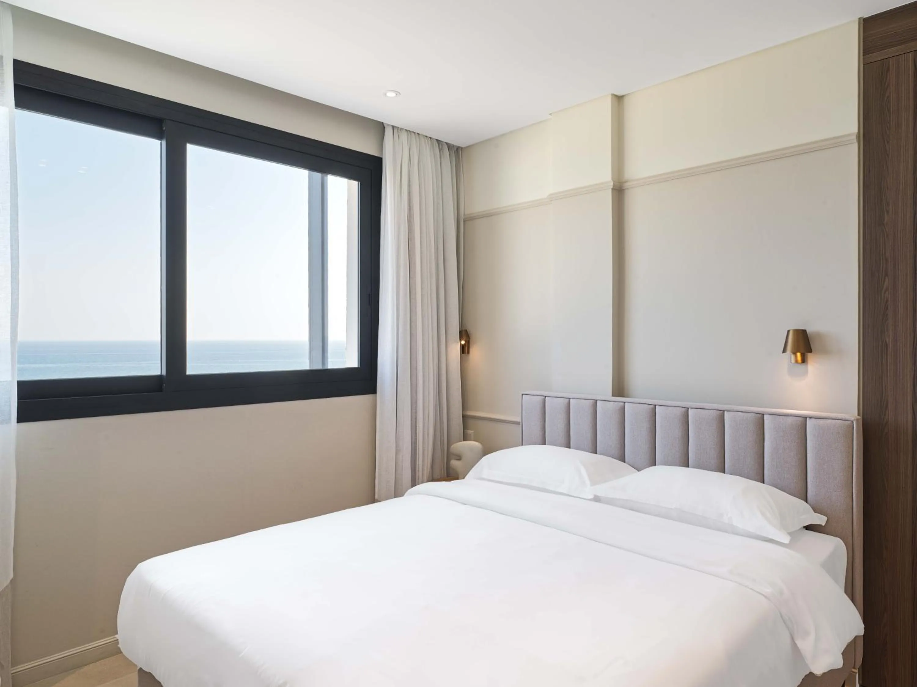 Bed in LIV Mackenzie Beach Suites Larnaca ADULTS ONLY