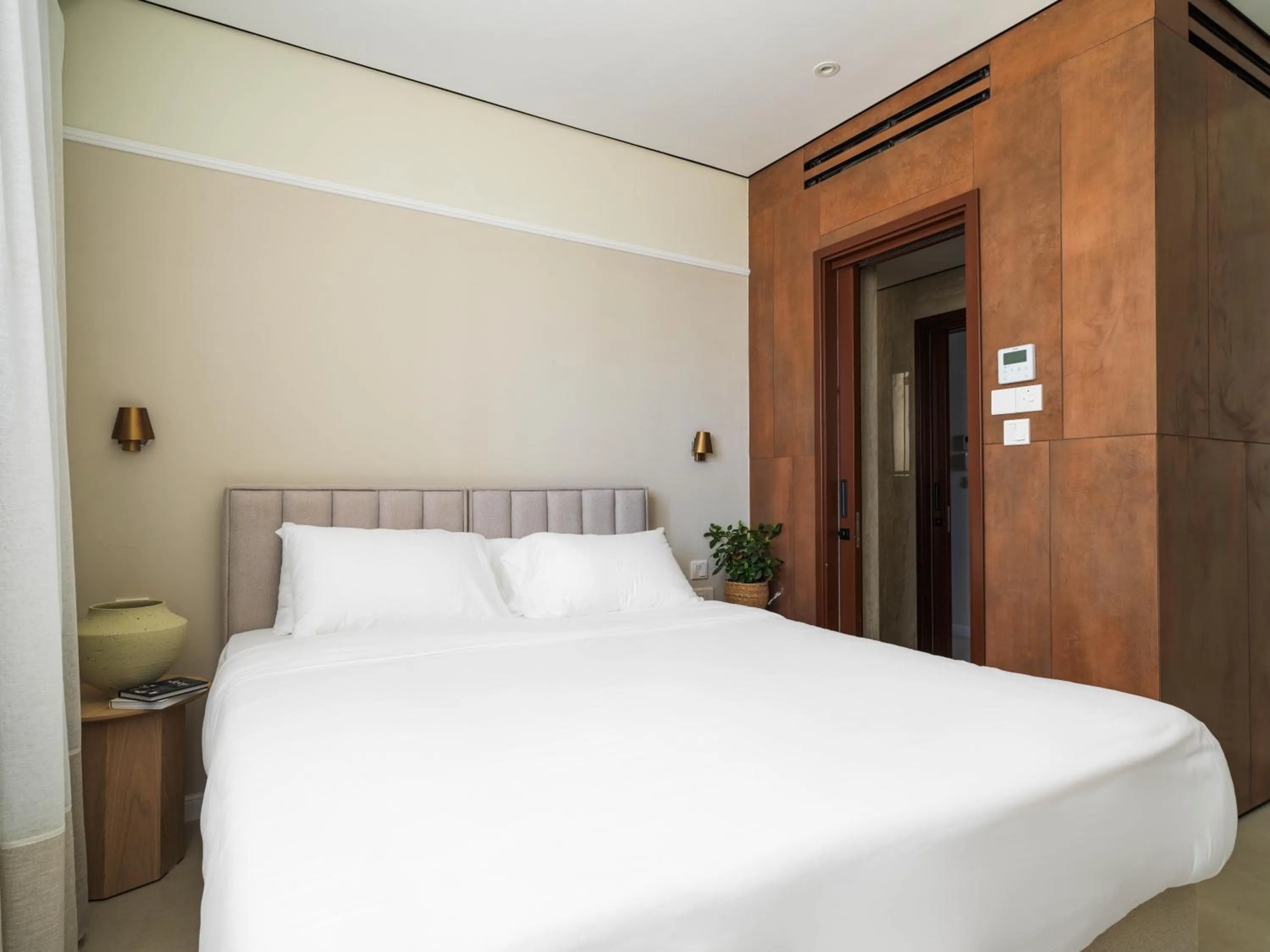 Bed in LIV Mackenzie Beach Suites Larnaca ADULTS ONLY