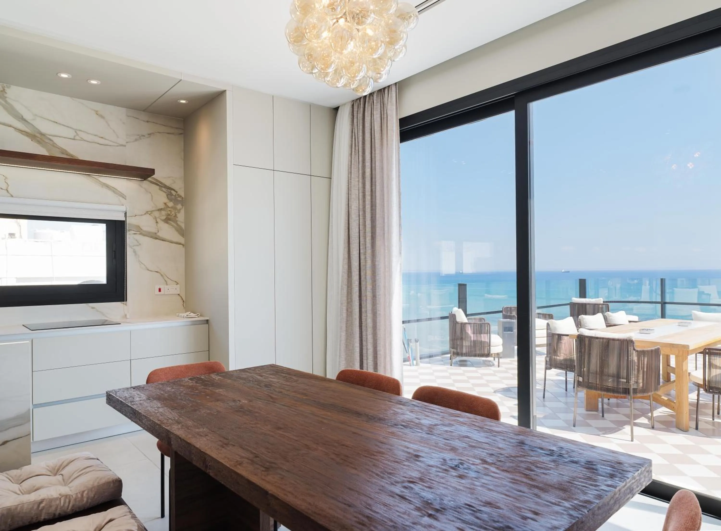 Dining area in LIV Mackenzie Beach Suites Larnaca ADULTS ONLY