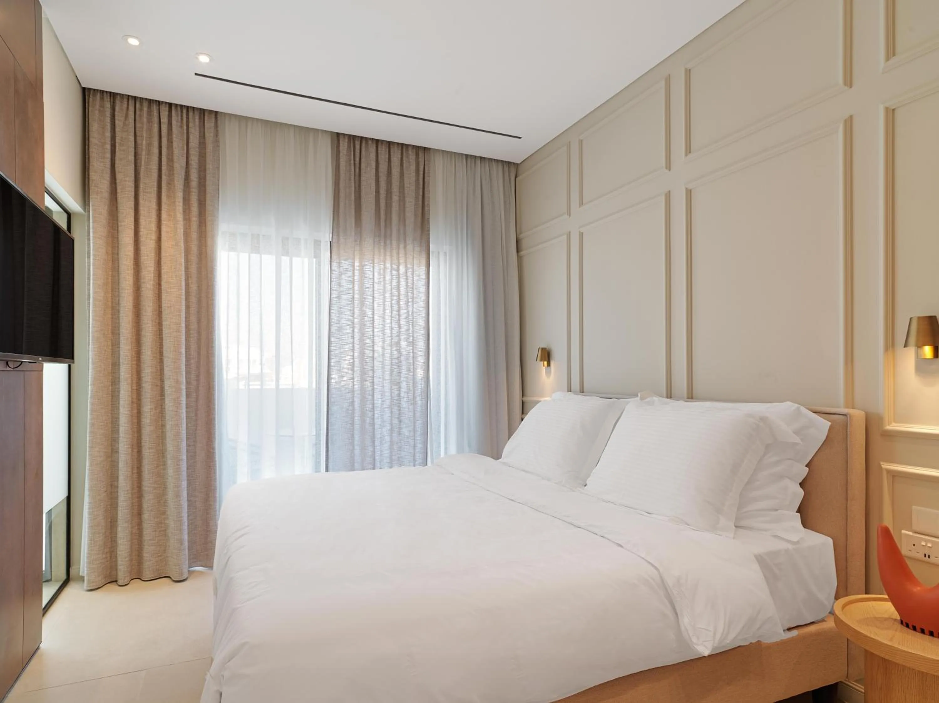 Bedroom, Bed in LIV Mackenzie Beach Suites Larnaca ADULTS ONLY