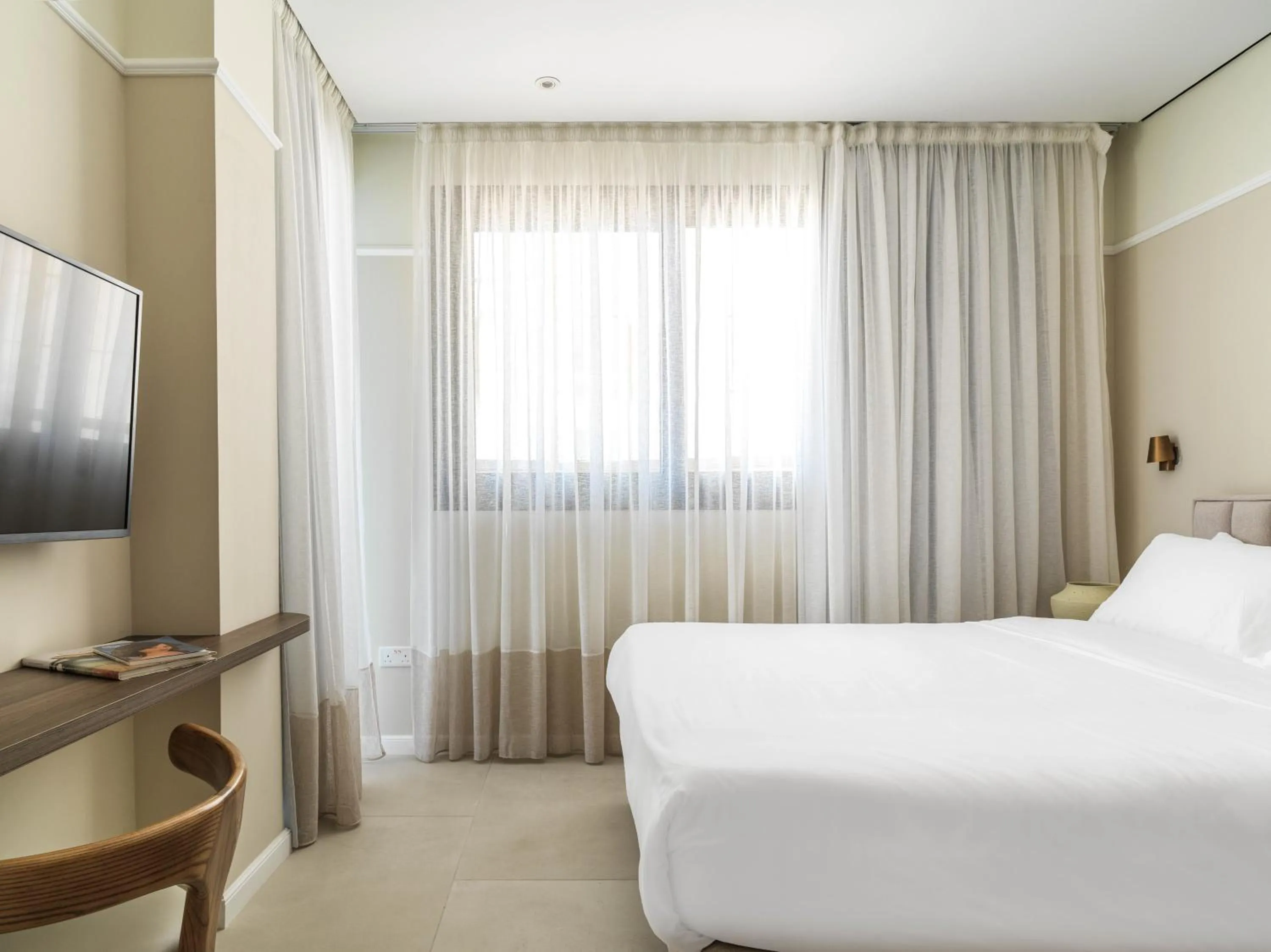 Bed in LIV Mackenzie Beach Suites Larnaca ADULTS ONLY