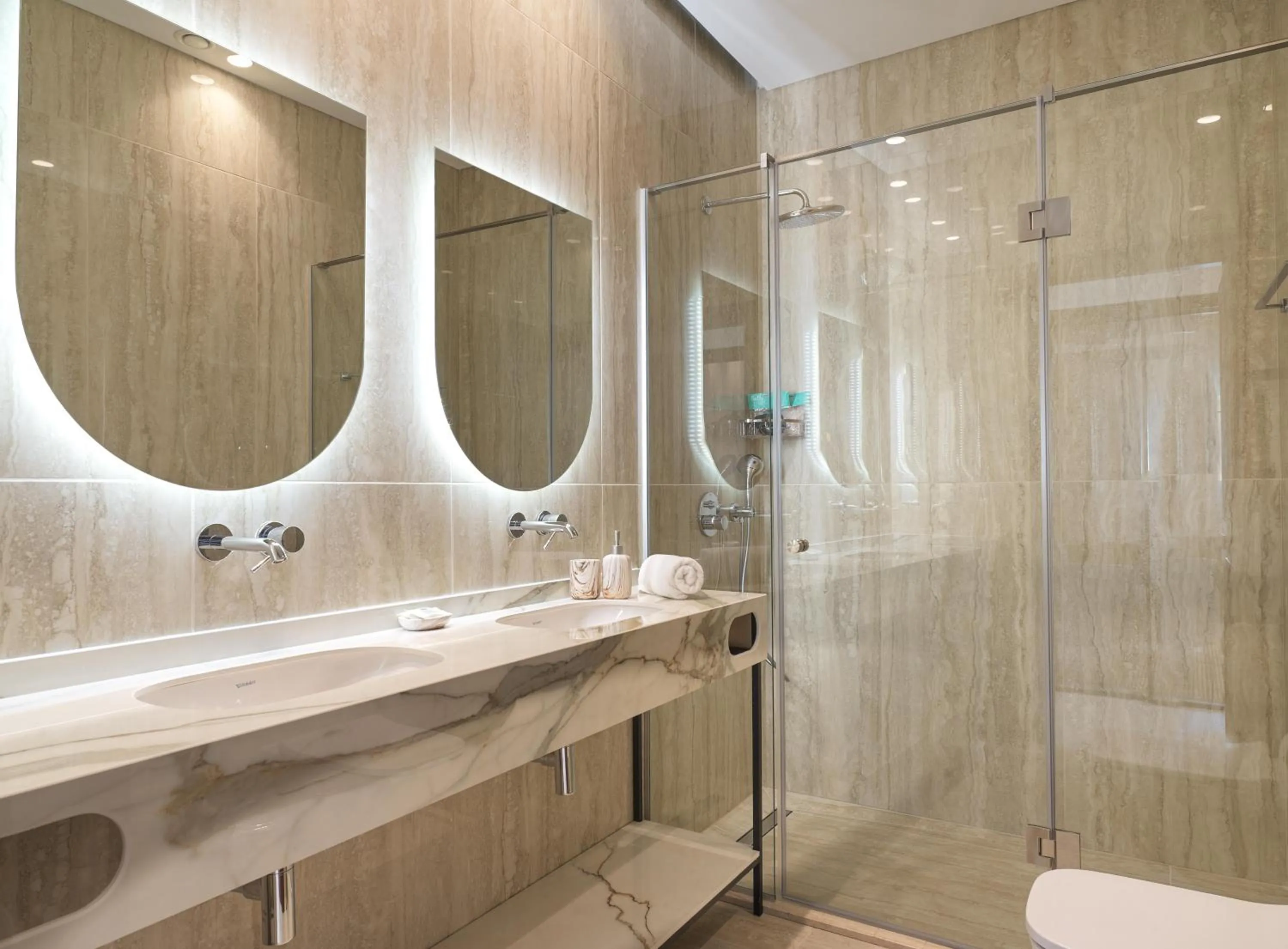 Bathroom in LIV Mackenzie Beach Suites Larnaca ADULTS ONLY