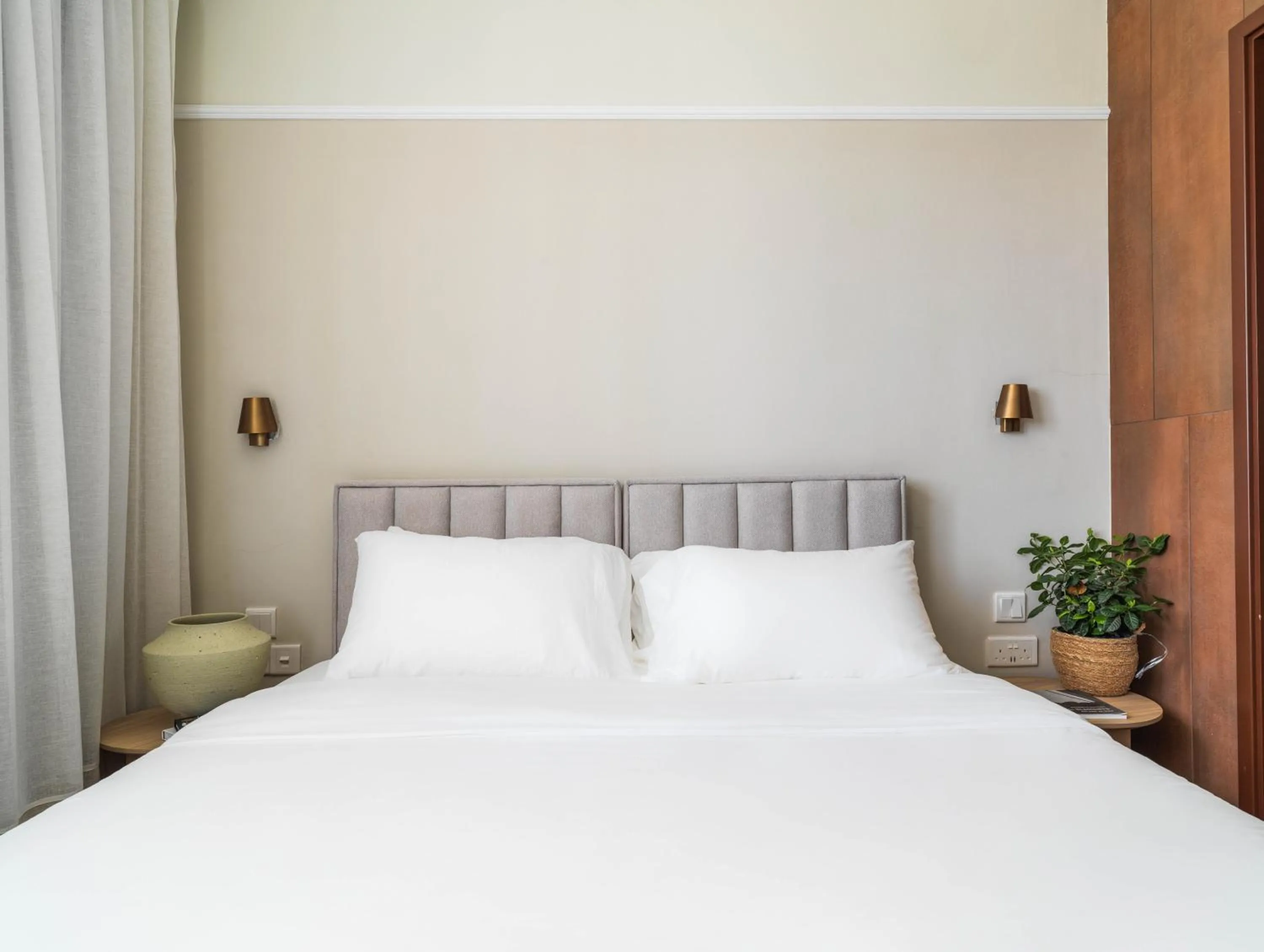 Bed in LIV Mackenzie Beach Suites Larnaca ADULTS ONLY