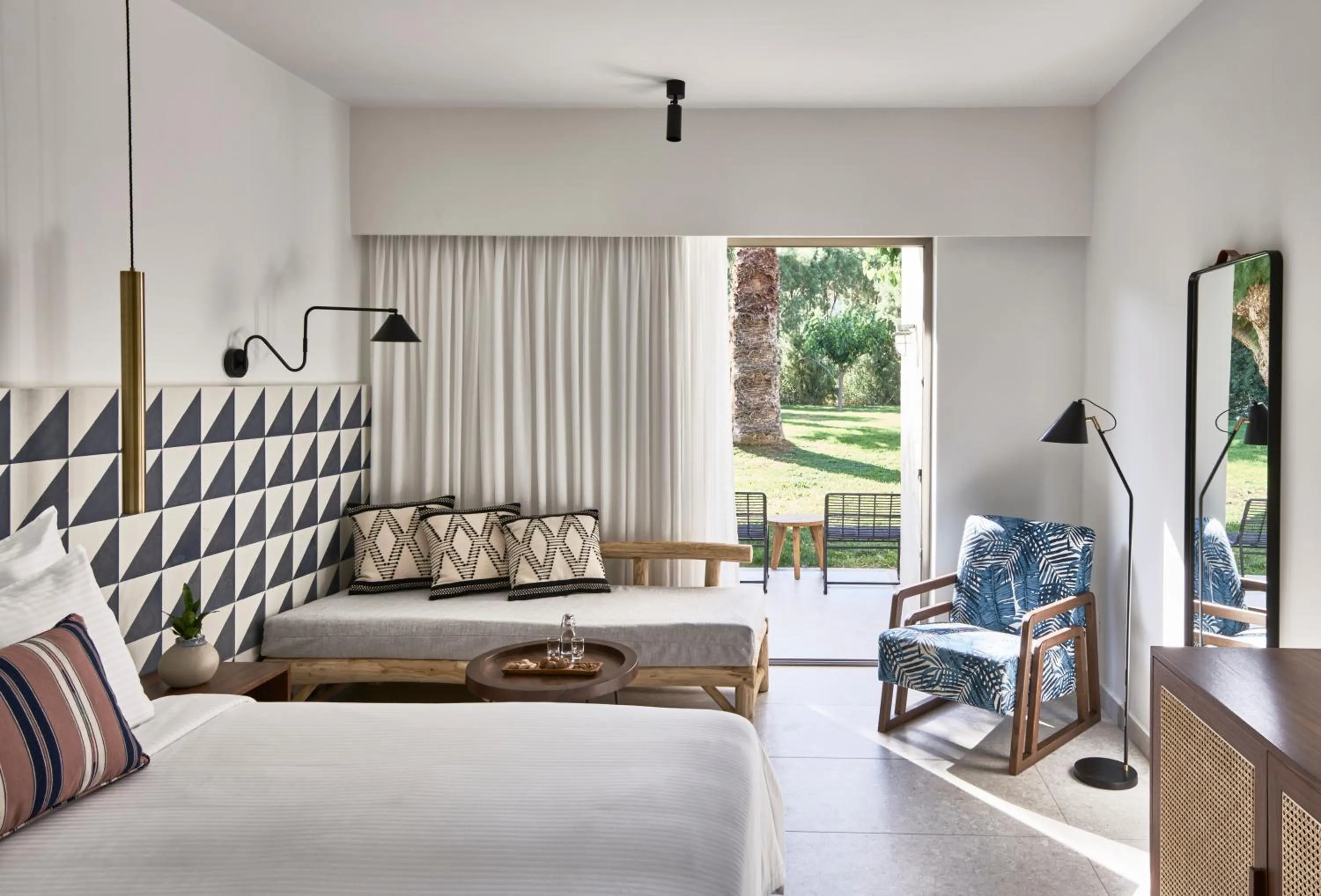 Seating area, Bed in Phāea Cretan Malia, a Member of Design Hotels