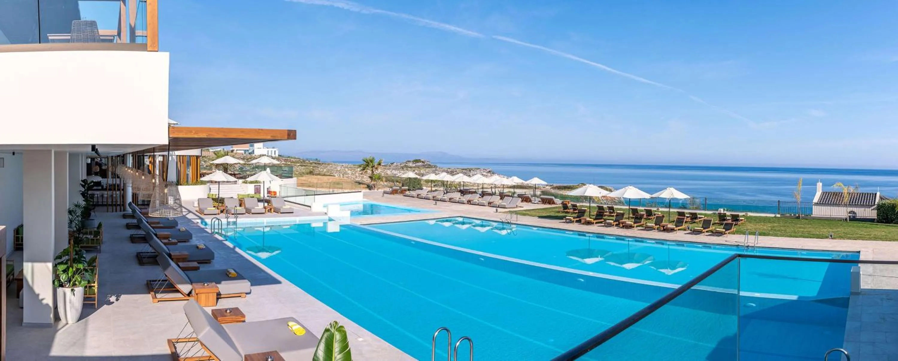 Pool view in Isla Brown Chania Resort, Curio Collection by Hilton