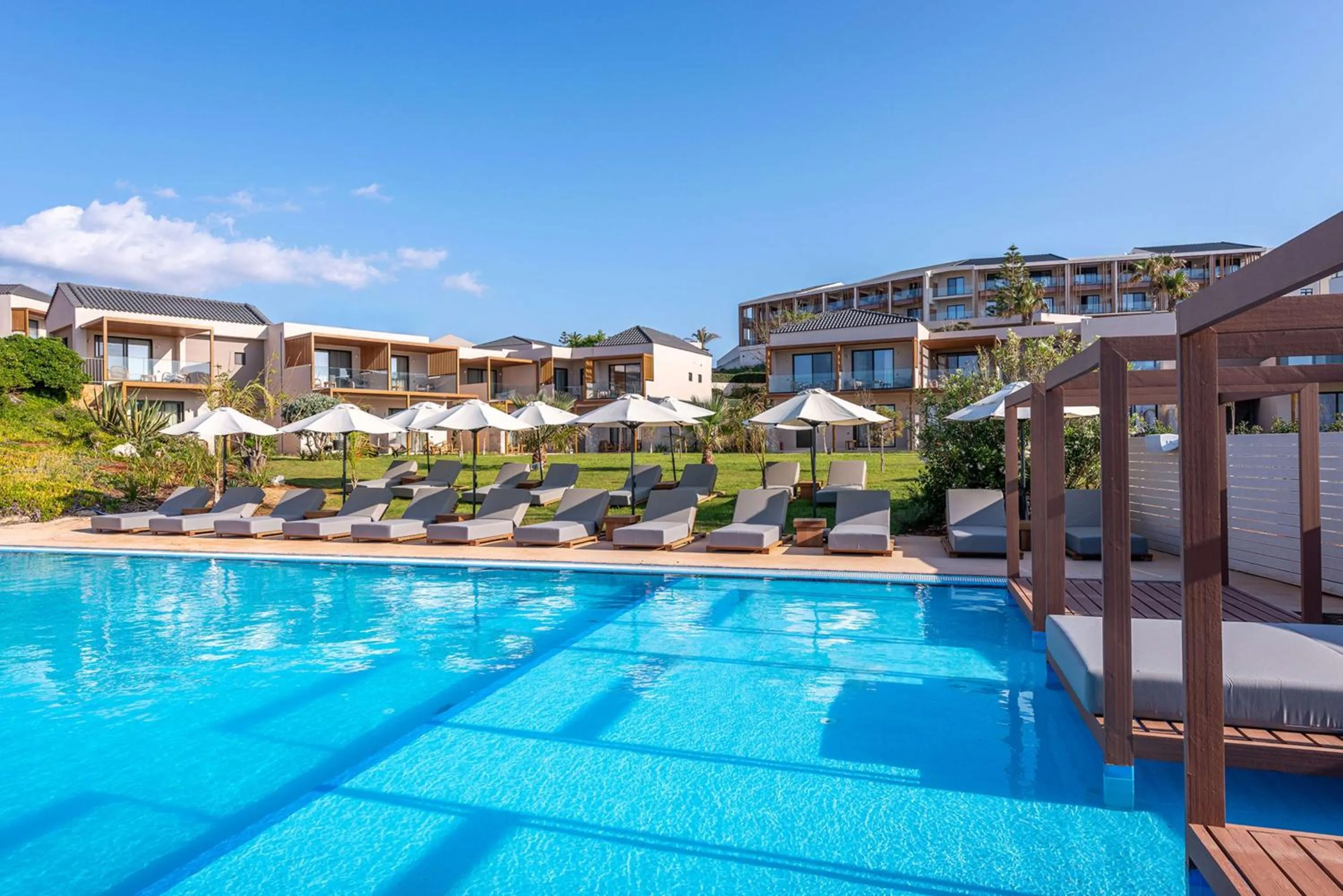 Pool view in Isla Brown Chania Resort, Curio Collection by Hilton