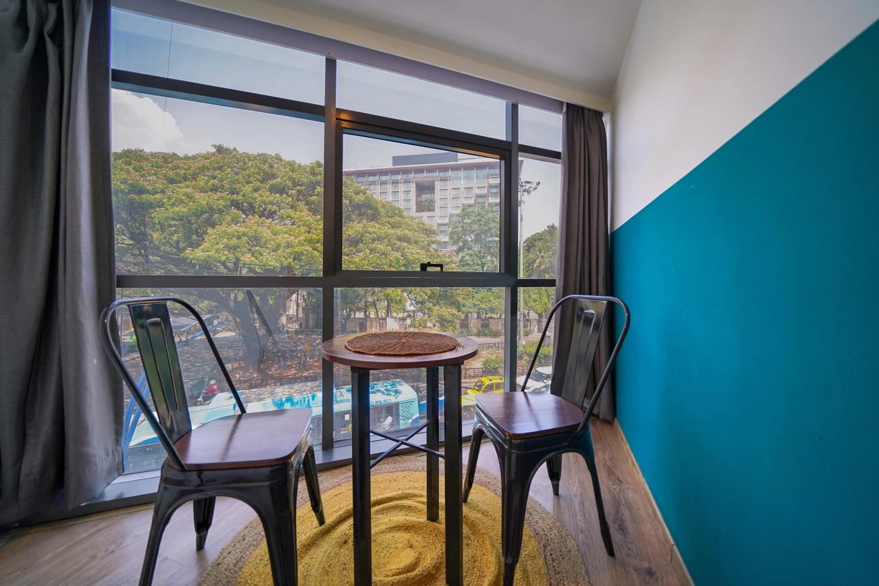 Seating area in Olive Zip Richmond Circle by Embassy Group