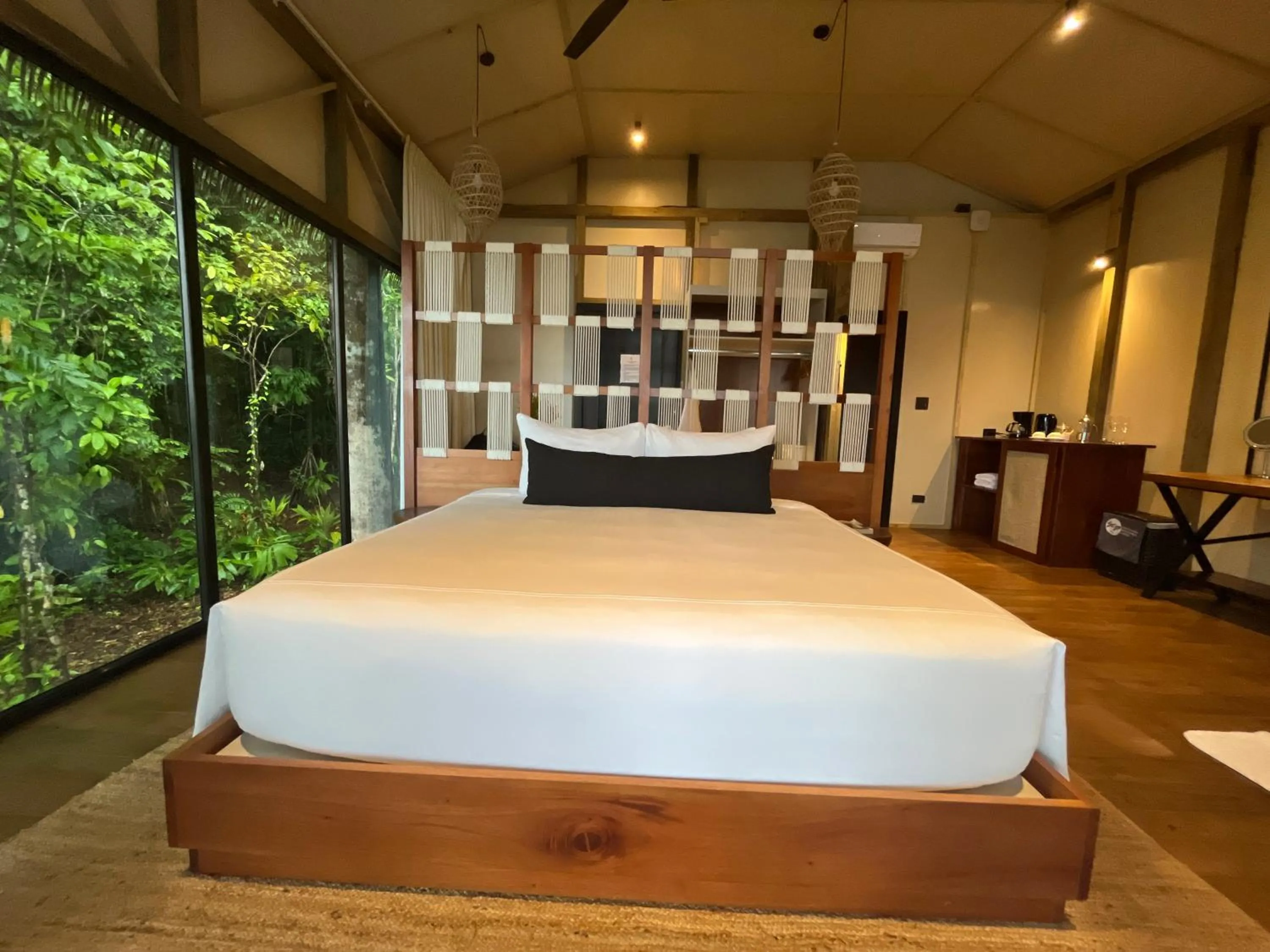 Bed in Corcovado Wilderness Lodge by SCP