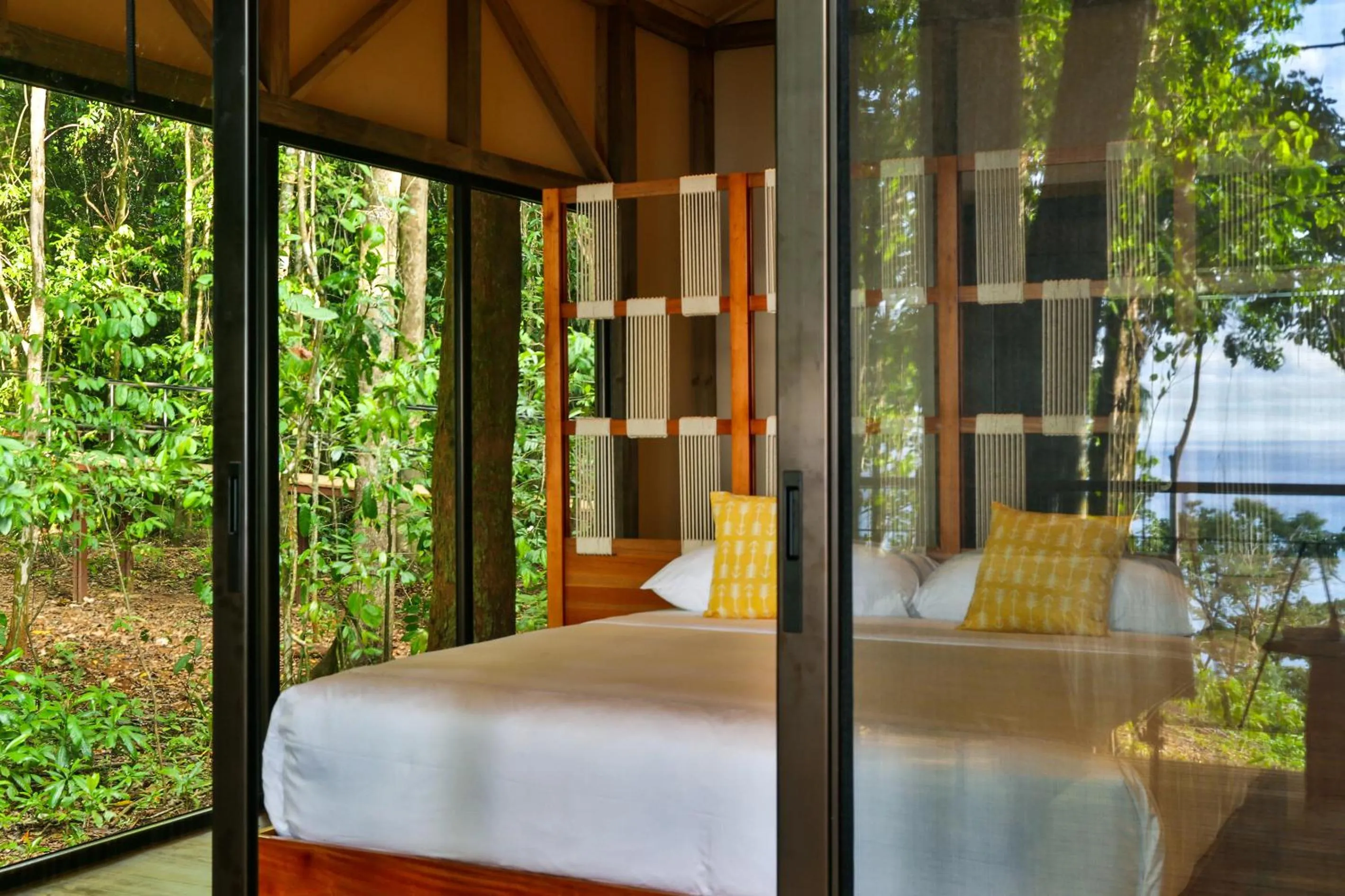 Bed in Corcovado Wilderness Lodge by SCP