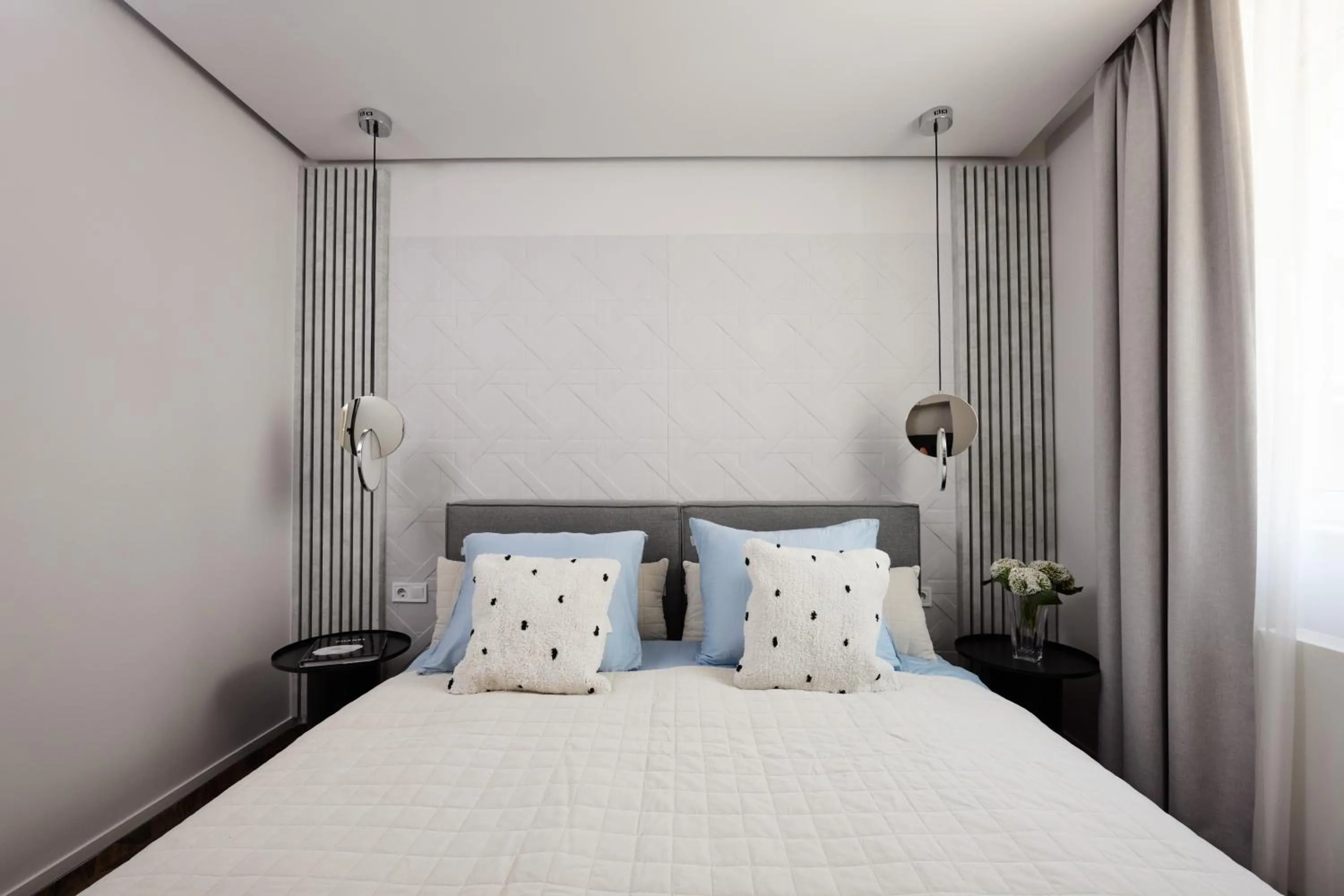 Bed in The Amberlyn Suite Hotel