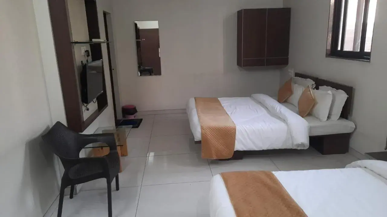 Bed in Indrani Hotel Bed in Indrani Hotel