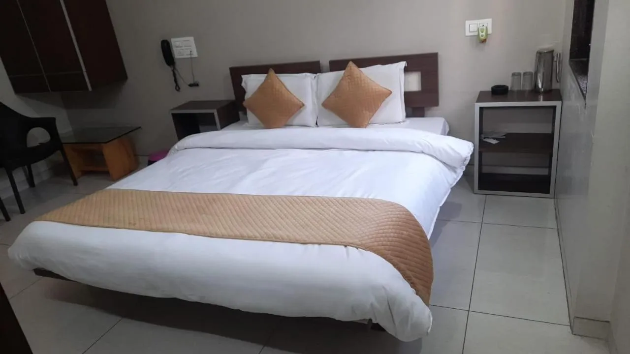 Bed in Indrani Hotel