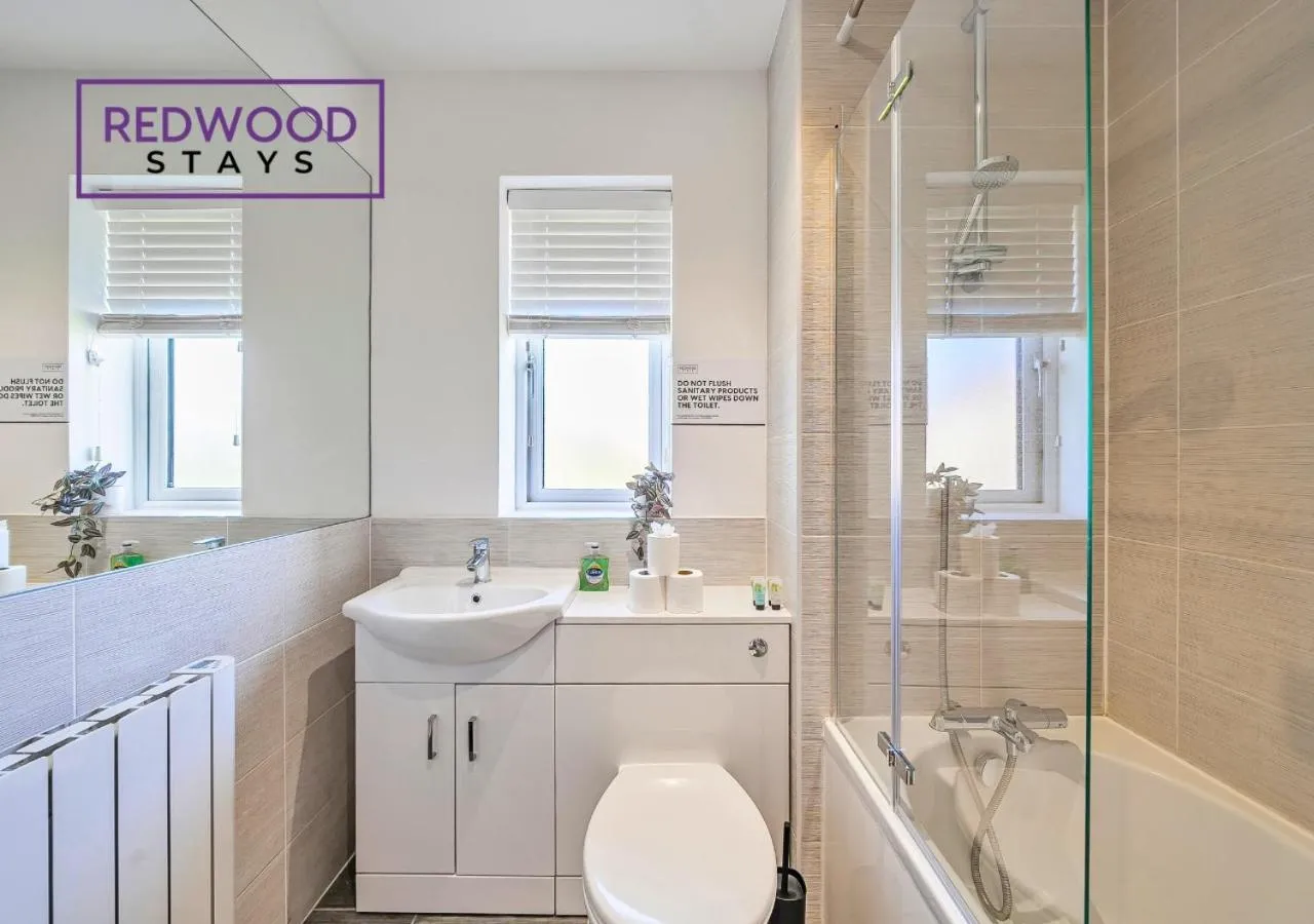 Shower in Modern Serviced Apartments For Contractors & Families with Free Parking, WiFi & Netflix By Redwood Stays