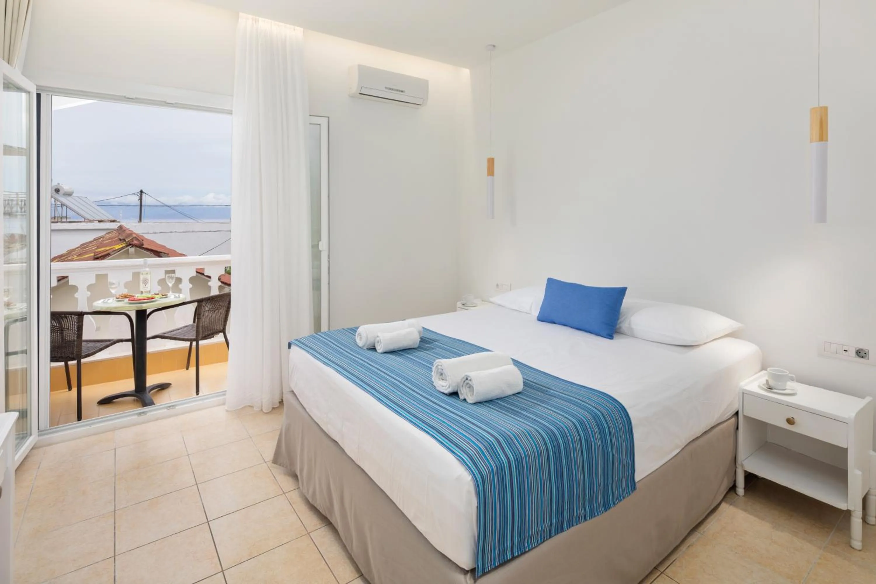 Bed in Bella Vista Beach Hotel