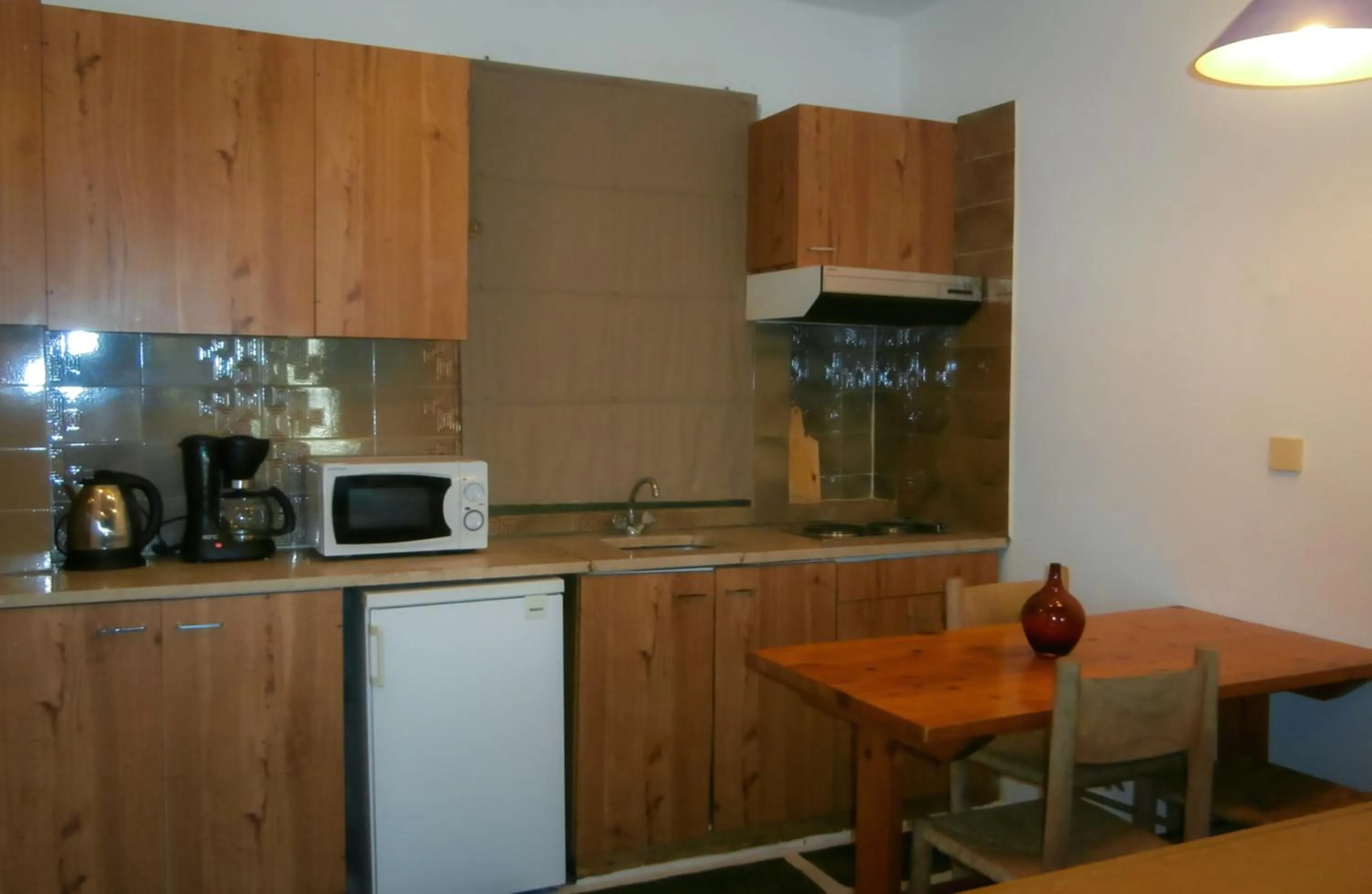 Kitchen or kitchenette in Apollonia Hotel Apartments